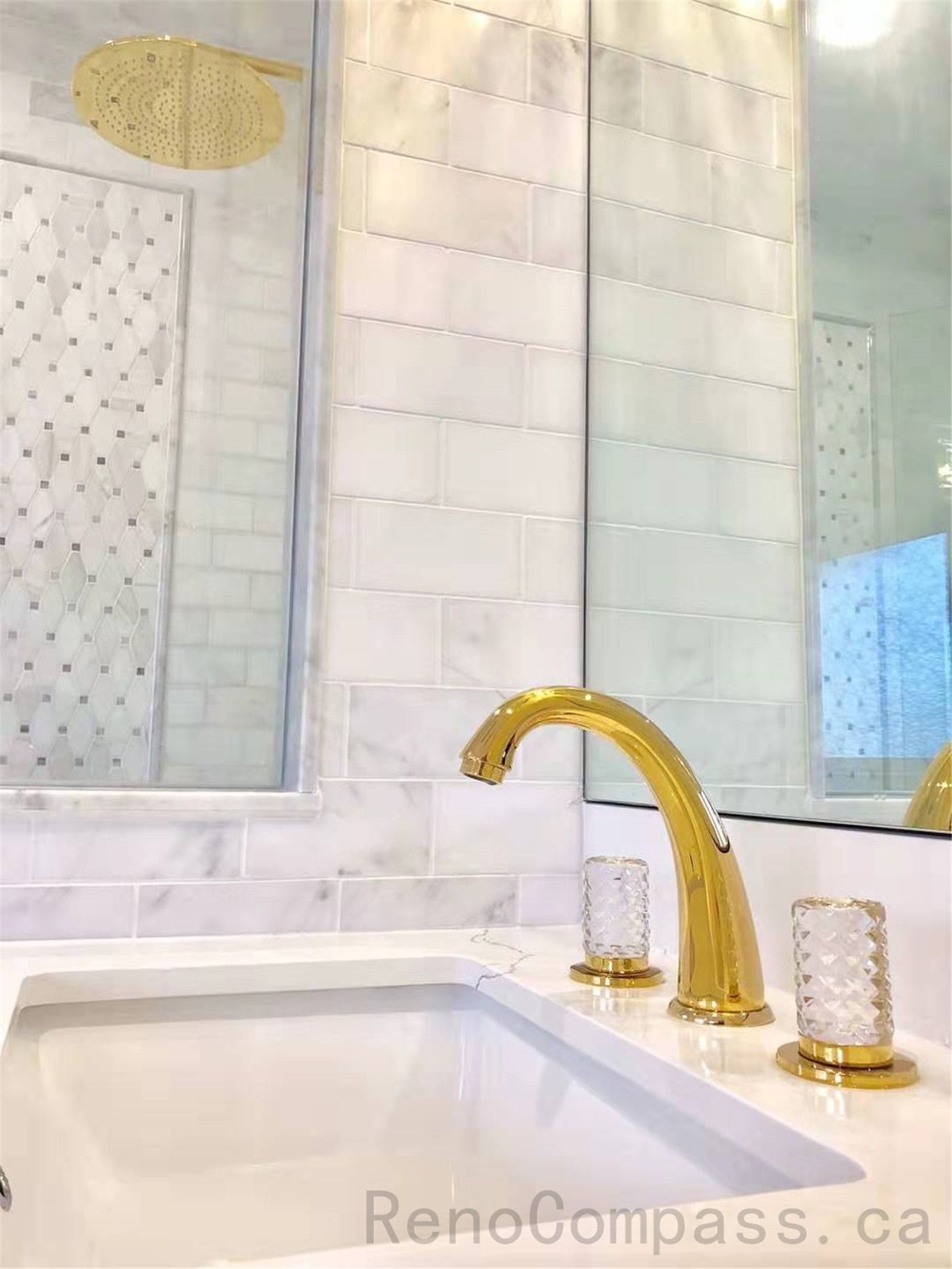 This North York bathroom renovation highlights elegant gold faucet fixtures, a freestanding bathtub, and marble-style tile finishes that create a bright and luxurious atmosphere. The refined material selection and detailed craftsmanship enhance both comfort and visual appeal. Completed by a professional Toronto renovation company specializing in high-end residential bathroom upgrades.