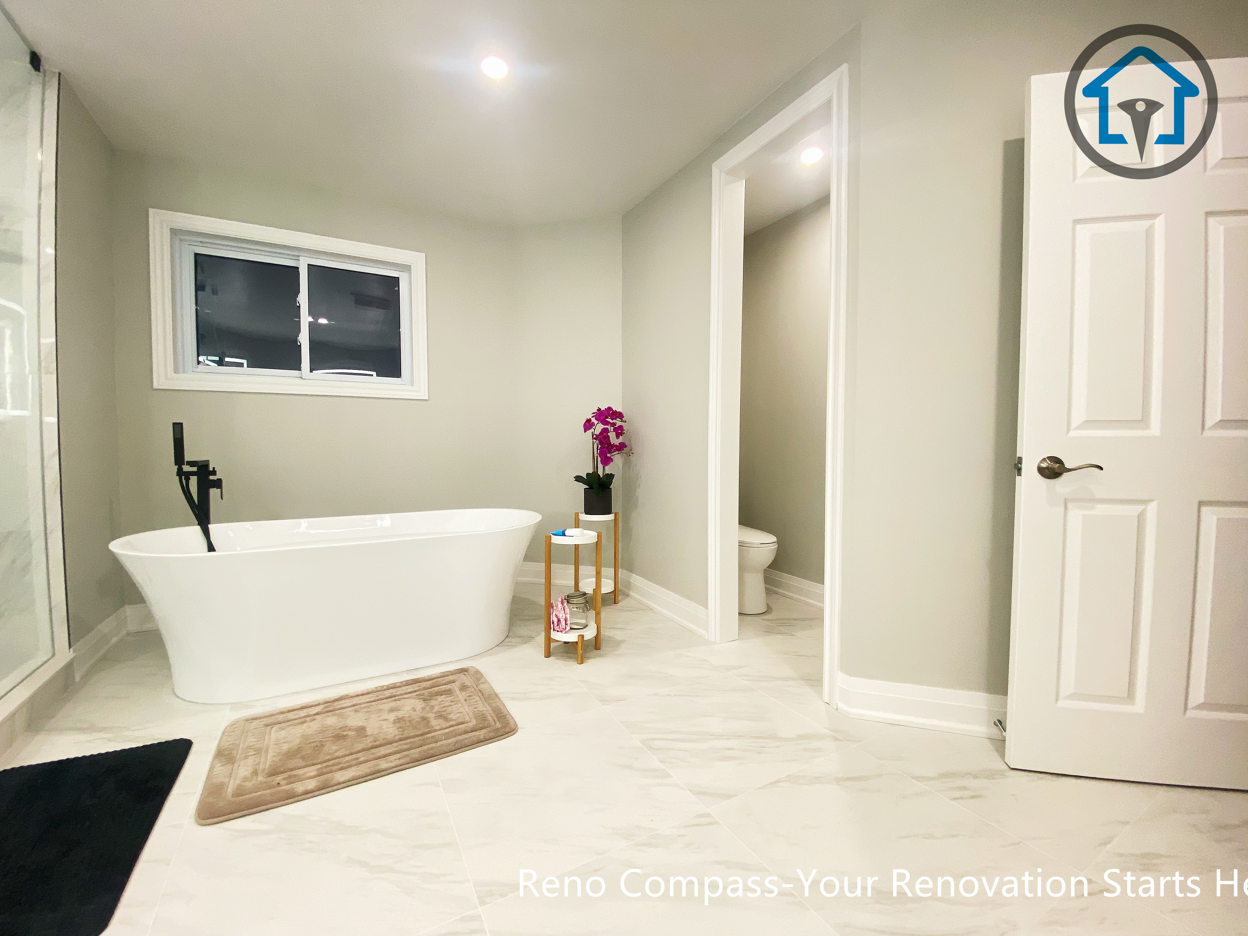 Bright primary bathroom renovation in Newmarket with a simplified layout, neutral color palette, and improved accessibility designed for long-term, comfortable living.