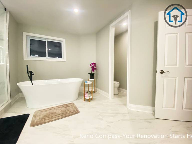 Bright primary bathroom renovation in Newmarket with a simplified layout, neutral color palette, and improved accessibility designed for long-term, comfortable living.