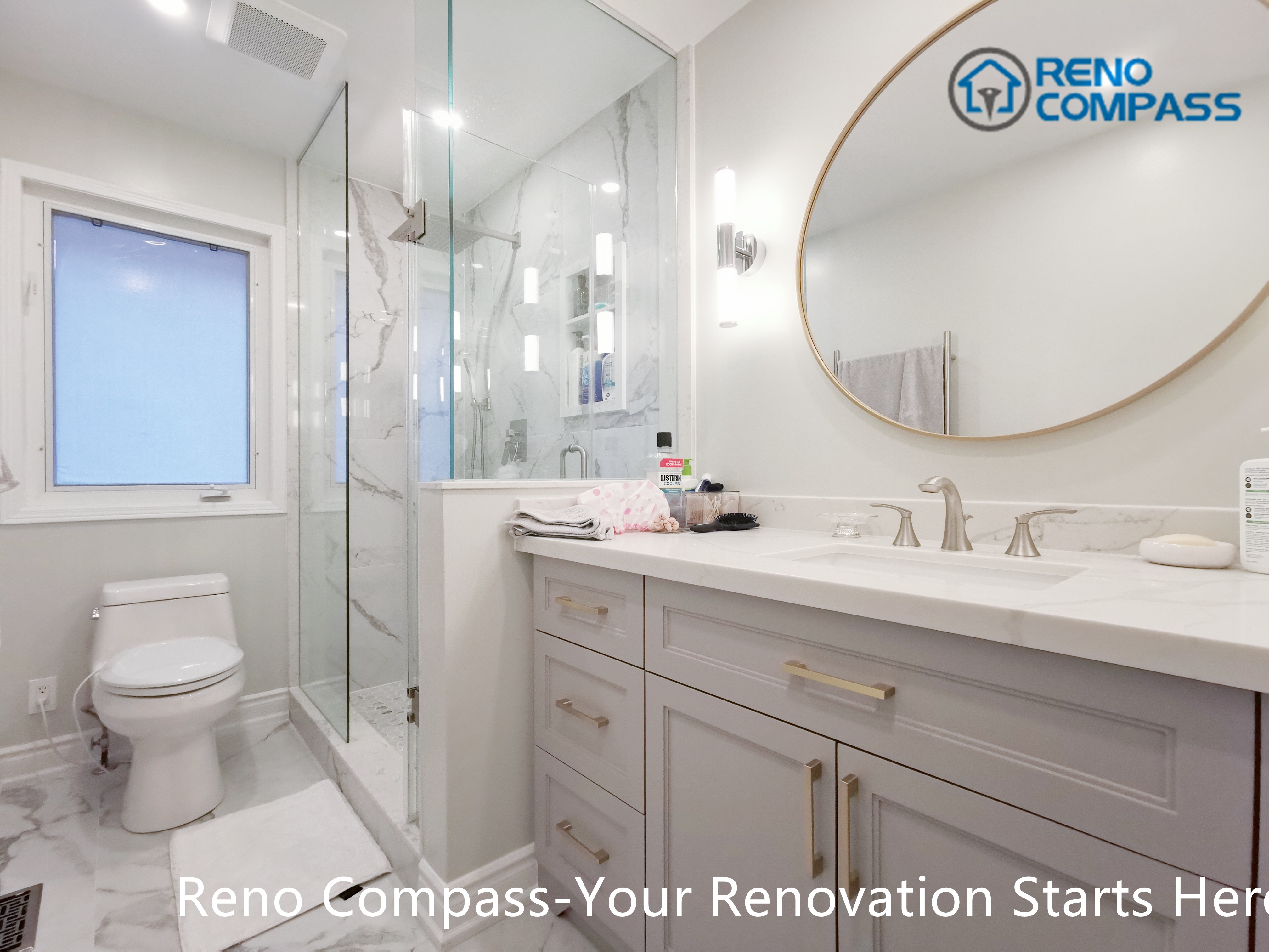 This Mississauga bathroom renovation features a custom vanity with soft grey cabinetry, brushed gold hardware, and a clean quartz countertop. A round framed mirror paired with vertical wall sconces provides balanced lighting for daily use while enhancing the overall elegance of the space. Thoughtful storage design and refined finishes reflect the attention to detail and craftsmanship expected from a professional Toronto renovation company.