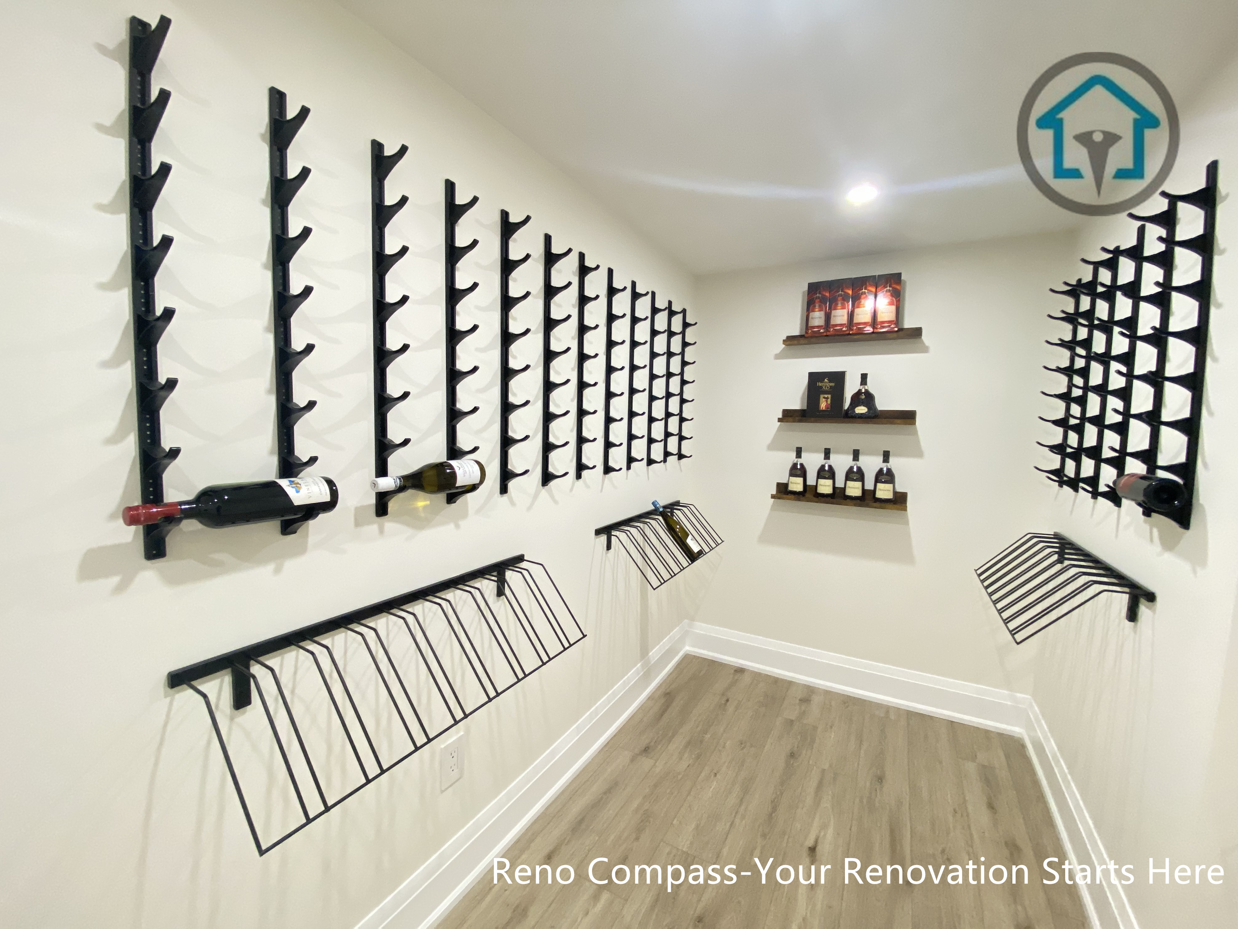 This image features a custom-designed wine cellar within a Richmond Hill interior renovation, showcasing symmetrical wall-mounted wine racks and a clean, gallery-style layout. The narrow corridor design maximizes bottle storage while maintaining visual order and ease of access. Neutral finishes and wood flooring add warmth and balance to the space. Designed and completed by Reno Compass, this wine storage solution reflects a refined approach to functional interior design for homes in Richmond Hill.
