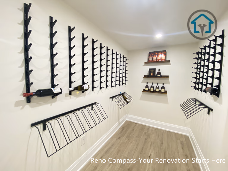 This image features a custom-designed wine cellar within a Richmond Hill interior renovation, showcasing symmetrical wall-mounted wine racks and a clean, gallery-style layout. The narrow corridor design maximizes bottle storage while maintaining visual order and ease of access. Neutral finishes and wood flooring add warmth and balance to the space. Designed and completed by Reno Compass, this wine storage solution reflects a refined approach to functional interior design for homes in Richmond Hill.