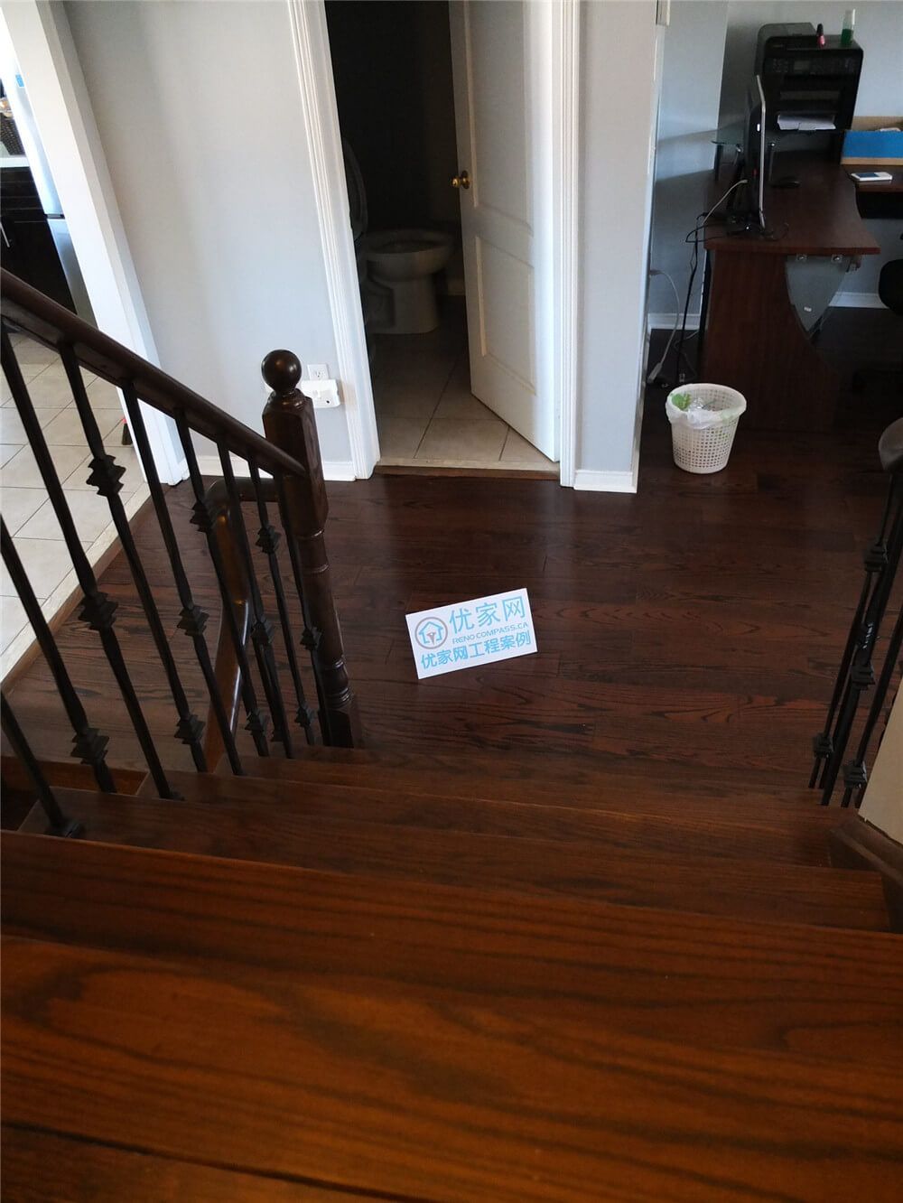 This image highlights the completed hardwood flooring and staircase renovation in a Mississauga home. The project features deep-toned hardwood flooring, solid wood stair treads, and modern iron railings that create a clean and elegant interior transition between levels. As a professional Toronto Renovation Company, Reno Compass delivers precise flooring installation and staircase upgrades that enhance both durability and visual appeal in residential renovation projects.