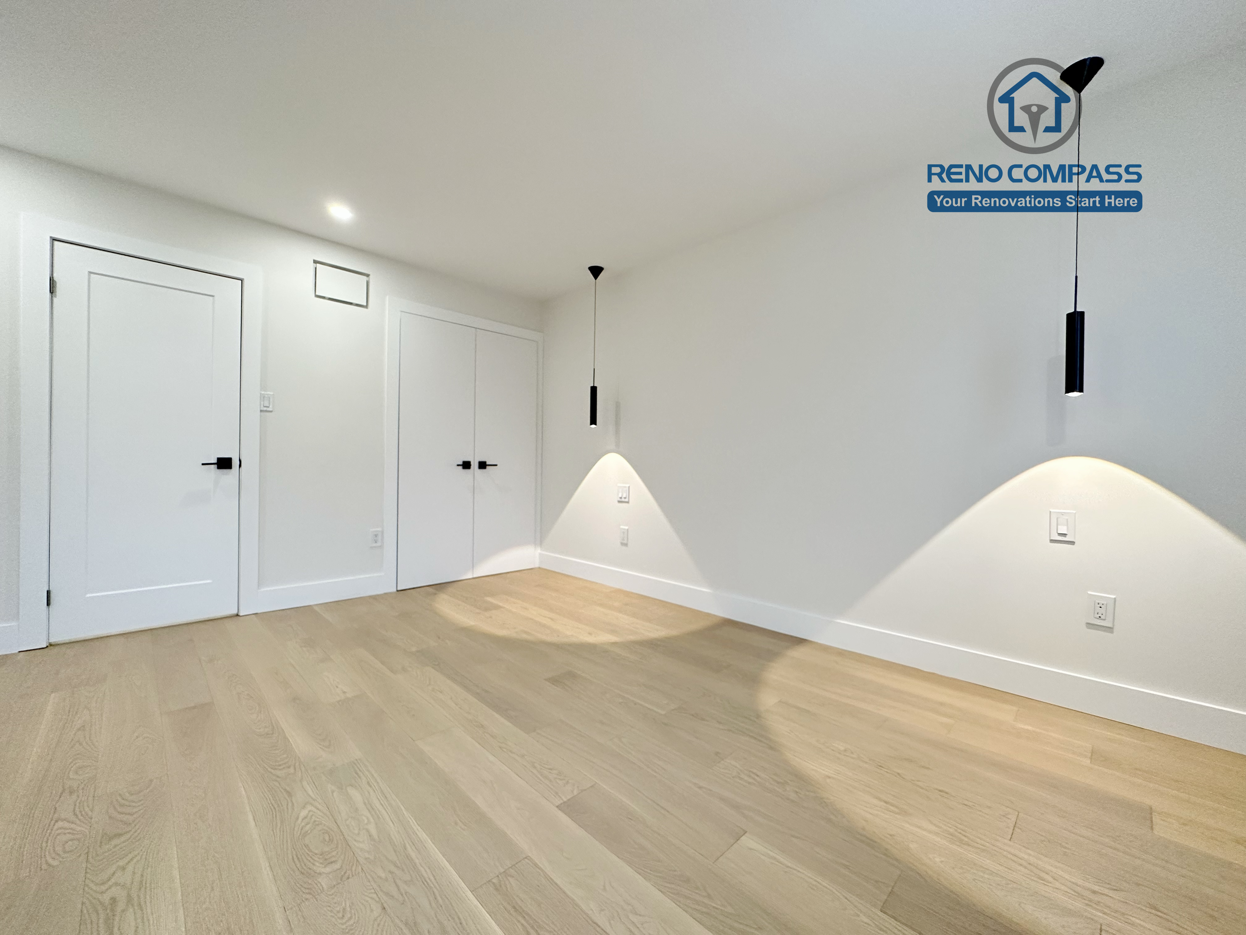 Modern bedroom renovation in a Richmond Hill home featuring light-tone hardwood flooring, minimalist pendant accent lighting, clean white walls, and a sleek, contemporary interior finish.