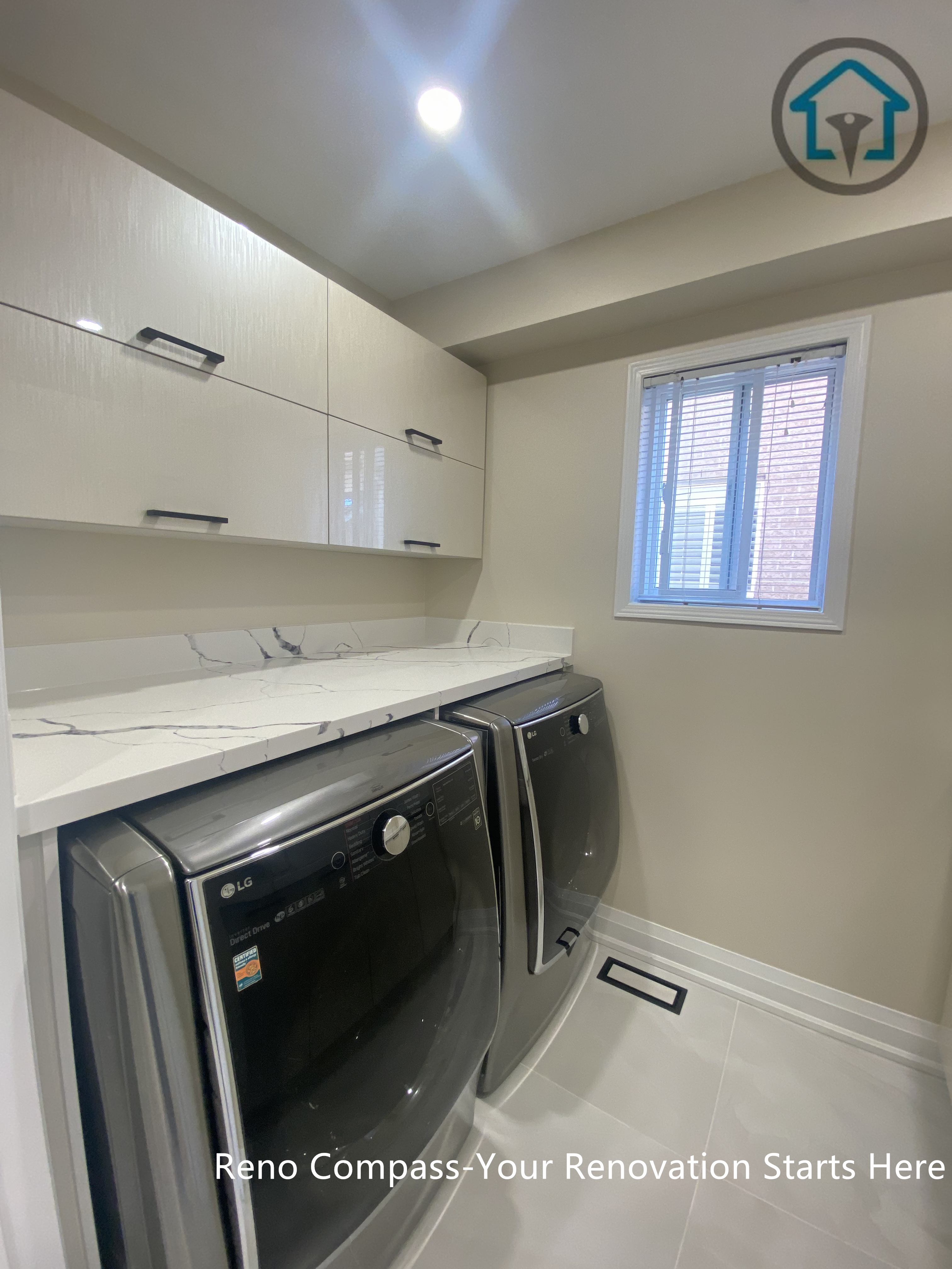 Laundry room view from a completed interior renovation project in Vaughan, featuring a clean and functional utility space by Reno Compass.