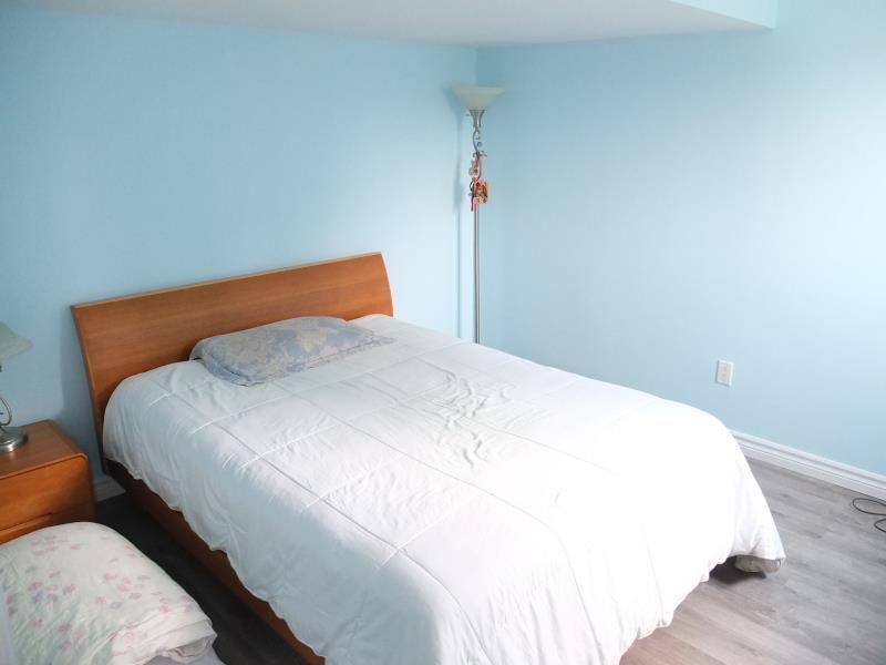 This bedroom renovation in Richmond Hill features newly painted walls in a soft, calming tone paired with modern wood-look flooring to create a clean and comfortable living space. The simple layout improves daily functionality while enhancing brightness and visual openness. As part of a complete interior renovation, this bedroom upgrade reflects careful finishing details and practical design choices delivered by a trusted Toronto renovation company serving Richmond Hill homeowners.
