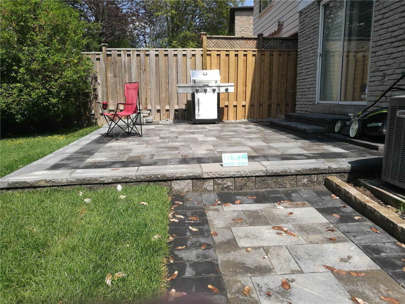 This Markham backyard renovation features a professionally installed interlocking stone patio designed for outdoor dining and relaxation. The upgraded patio area improves drainage, durability, and overall visual appeal while creating a clean and functional outdoor living space. Completed by a trusted Toronto renovation and landscaping contractor, the project combines quality stonework, precise leveling, and practical layout planning to deliver a long-lasting and low-maintenance backyard environment.