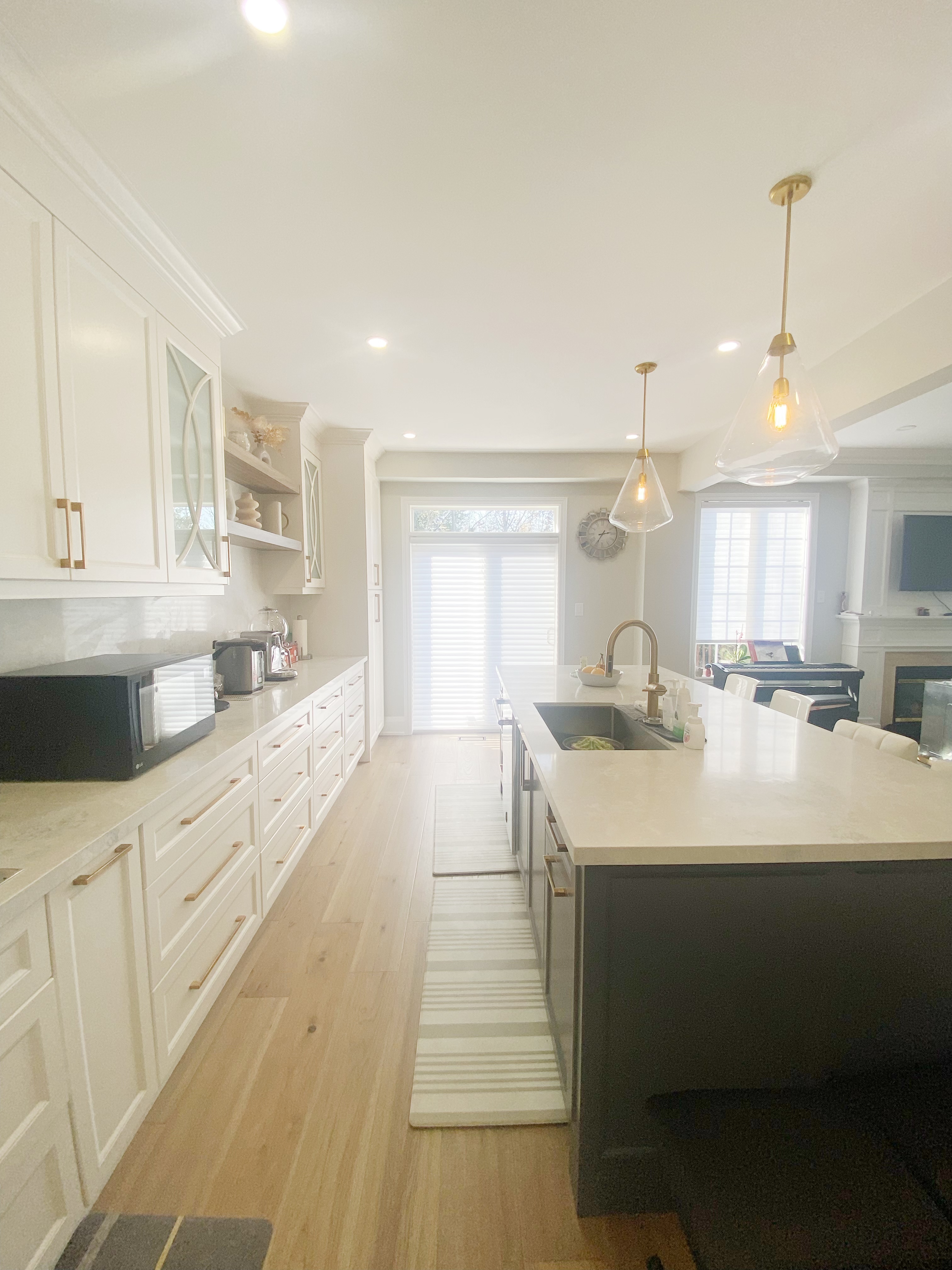 A functional kitchen layout completed as part of a Richmond Hill interior renovation, highlighting the island-centered workflow and extended countertop space.