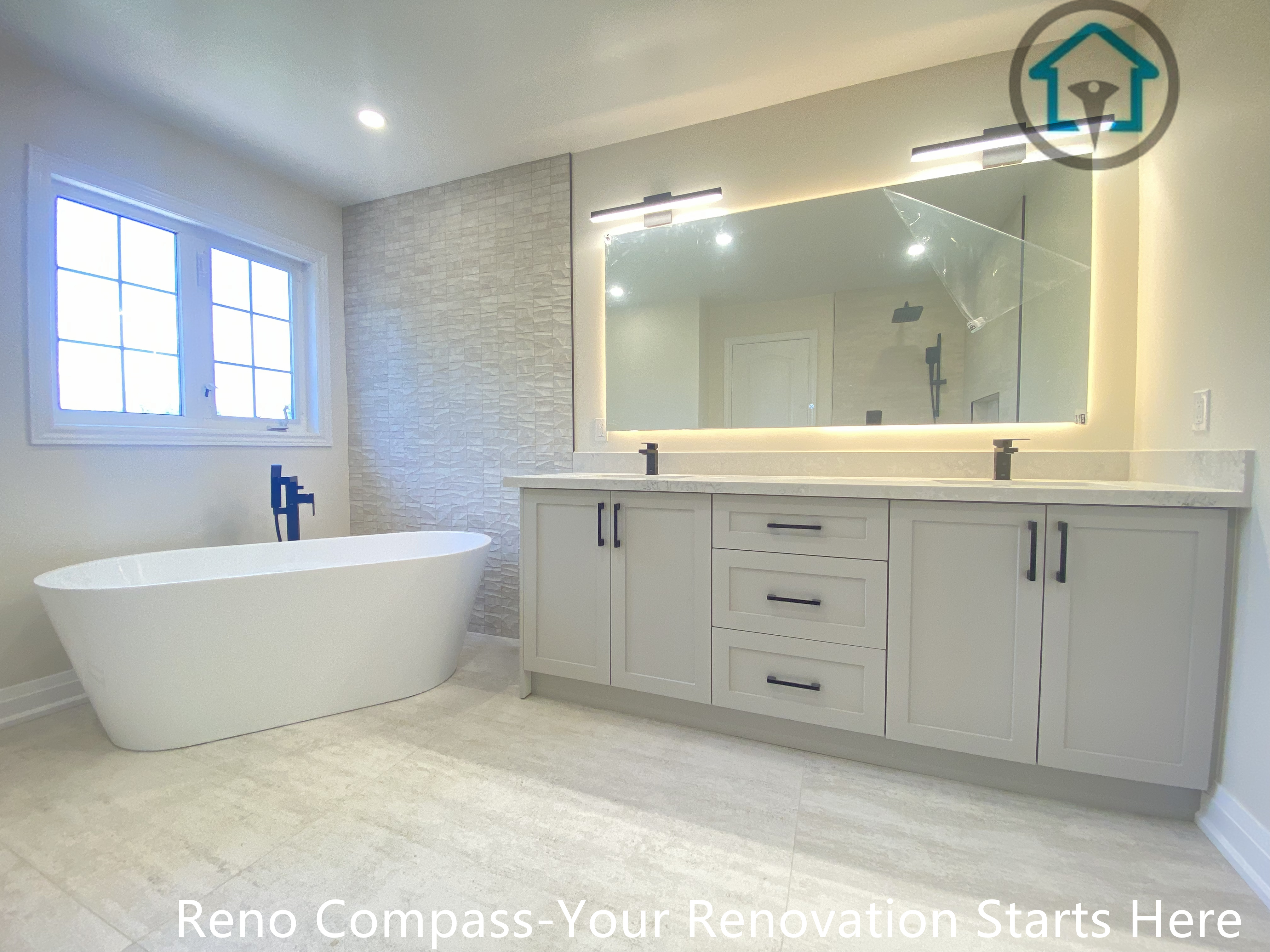 This Richmond Hill bathroom renovation showcases a freestanding bathtub paired with a custom double vanity and backlit mirror. The neutral color palette and spacious layout enhance brightness and comfort, delivering a modern and practical bathroom design completed by a professional Toronto renovation company.