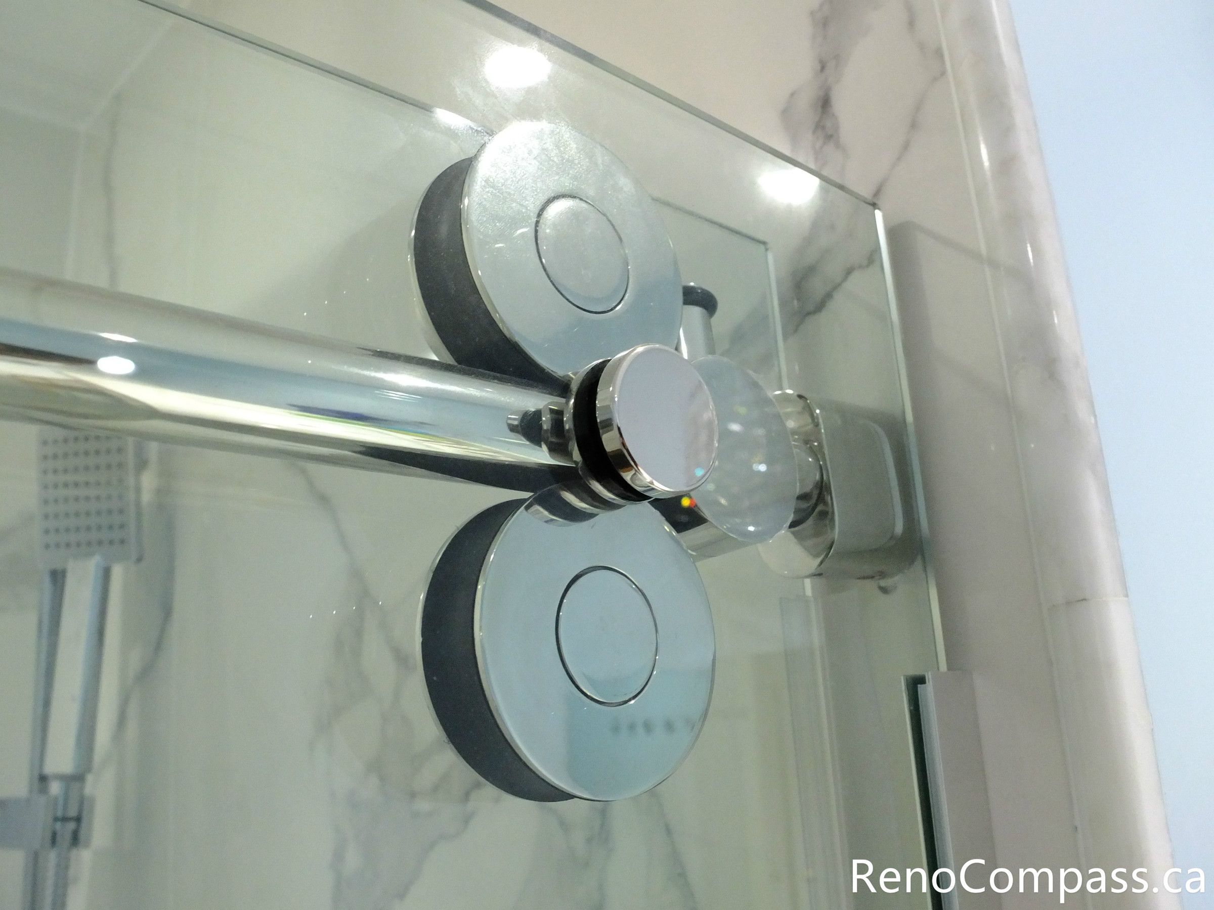 This Richmond Hill bathroom renovation highlights premium frameless glass shower door hardware with smooth sliding rollers and precision installation. Completed by a professional Toronto renovation company, the modern glass enclosure enhances durability, functionality, and sleek contemporary design, creating a refined and spacious shower experience.