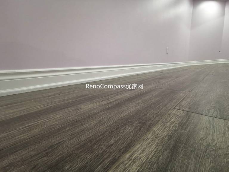 Close-up view of newly installed wood-look flooring in this Richmond Hill basement renovation project. The durable, moisture-resistant flooring was carefully installed with clean baseboard finishing to ensure long-term performance and modern aesthetics. Completed by a trusted Toronto renovation company, this upgraded basement flooring enhances comfort, visual warmth, and overall home value while providing a low-maintenance solution for everyday living.