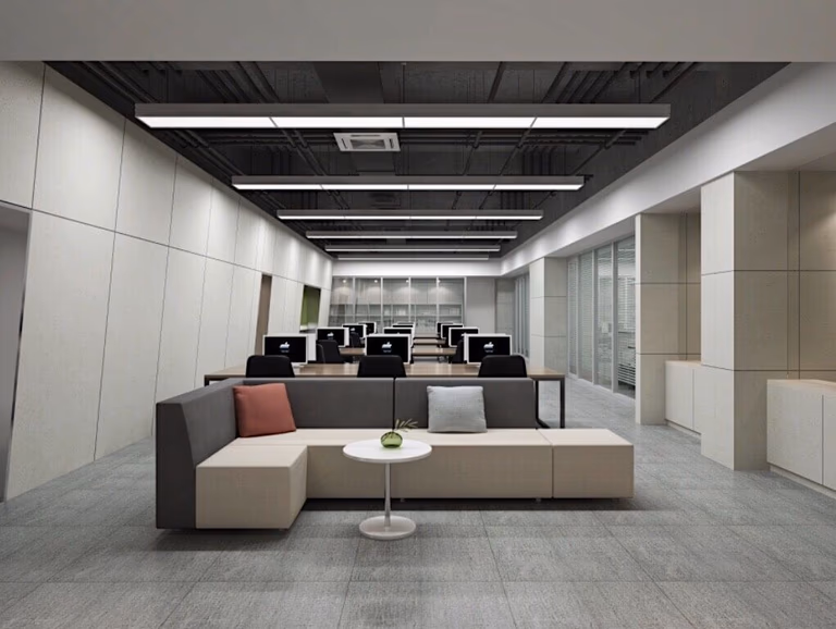 This Toronto office commercial renovation features a clean and modern open workspace design with minimalist furniture, linear ceiling lighting, and neutral-toned wall panels. The layout includes a comfortable lounge seating area, collaborative workstations, and glass-partition meeting spaces to support both teamwork and productivity. The industrial-style exposed ceiling combined with contemporary finishes creates a professional and functional office environment suitable for modern businesses. Completed by Reno Compass Inc., a trusted Toronto Renovation Company specializing in commercial office renovation and workplace design upgrades.