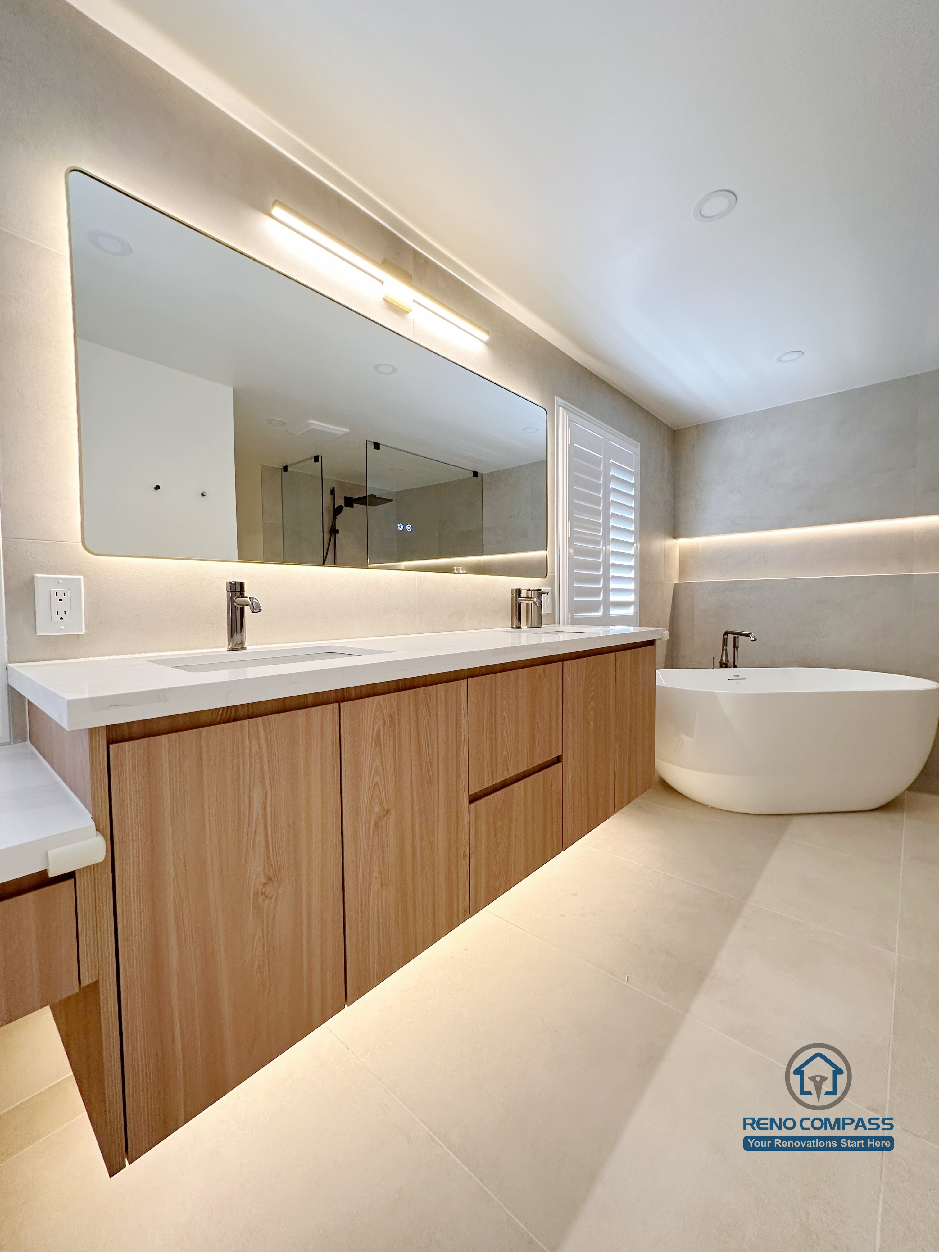 This Markham accessible bathroom renovation features a custom wood-tone vanity with ample floor clearance, integrated lighting, and easy reach access, paired with a thoughtfully positioned toilet area to support safe and comfortable movement. Wide-format tile flooring and unobstructed circulation improve accessibility without compromising design quality. Designed and built by a professional Toronto renovation company, Reno Compass Inc., the space prioritizes safety, usability, and long-term comfort.