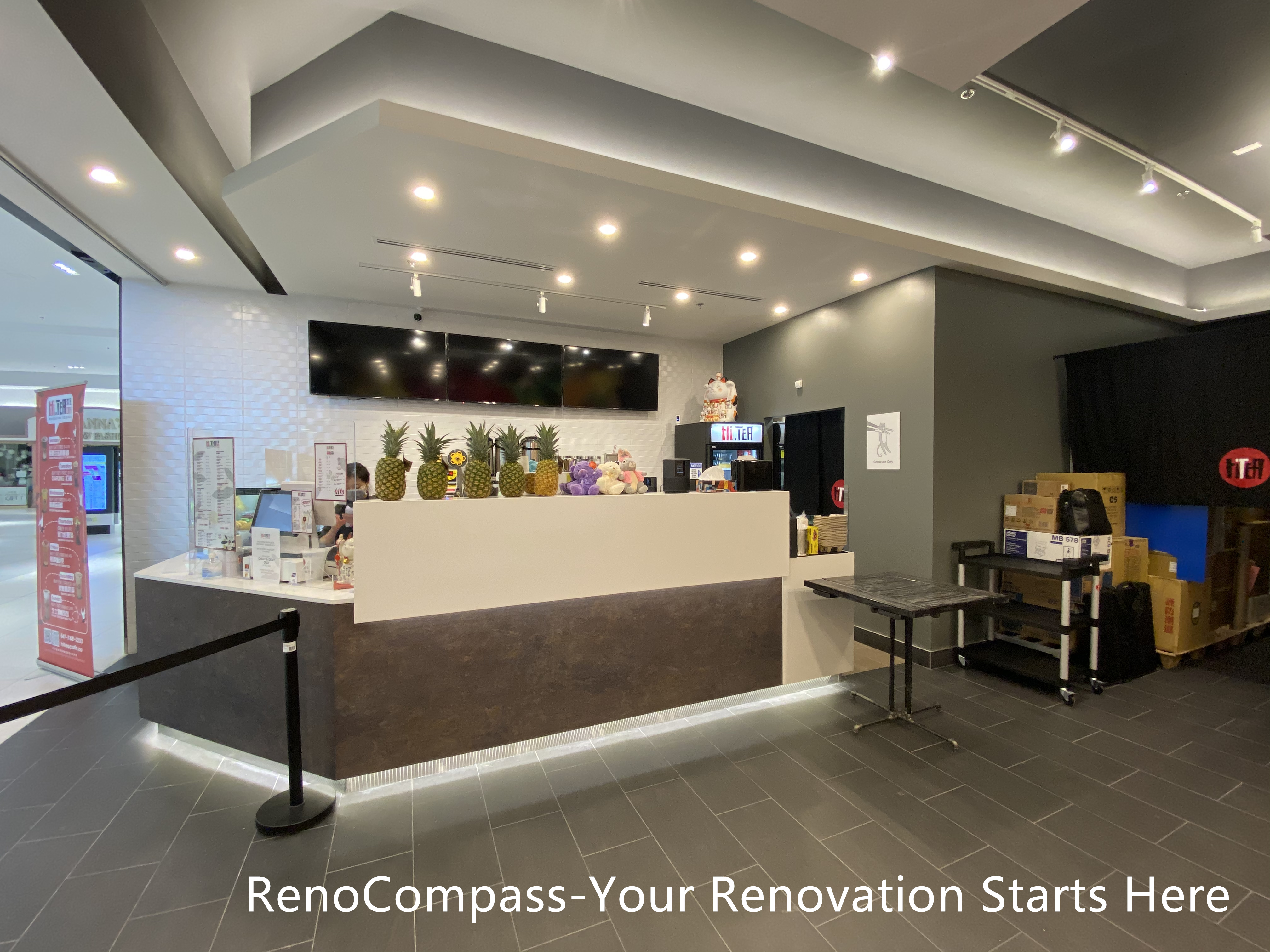 Restaurant renovation in Toronto showcasing a custom-built service counter, clean modern finishes, recessed ceiling lighting, and functional commercial layout. This project by Reno Compass Inc. focuses on efficient customer flow, durable flooring, and a bright, welcoming front-of-house environment for high-traffic restaurant spaces.