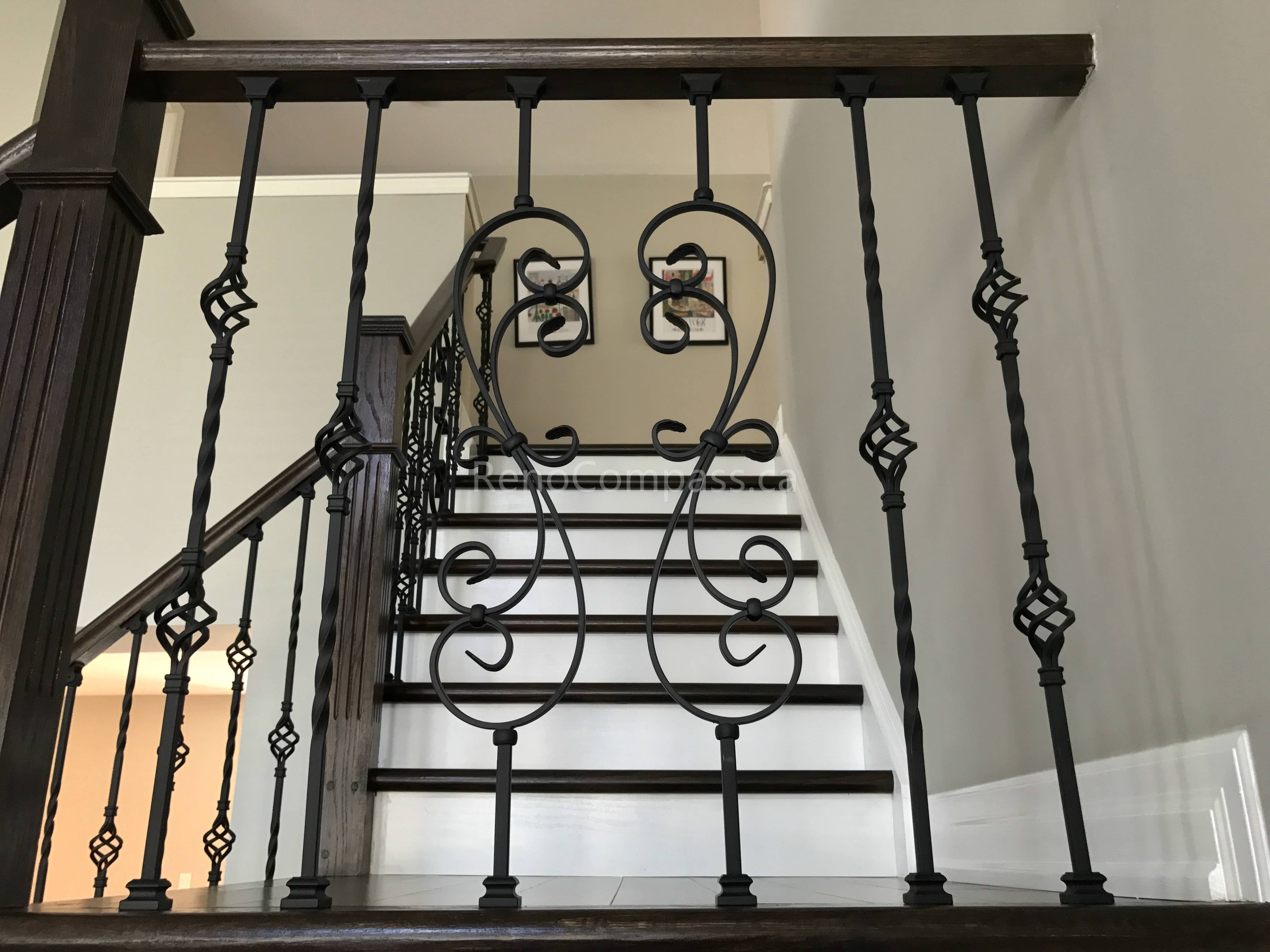 This Markham home renovation features a beautifully upgraded hardwood staircase with dark wood stair treads and elegant wrought iron railings. The contrast between the rich flooring and bright risers creates a clean, modern, and sophisticated visual impact. Completed by a trusted Toronto renovation company, this staircase upgrade enhances both safety and interior aesthetics while maintaining a cohesive flooring design throughout the home.