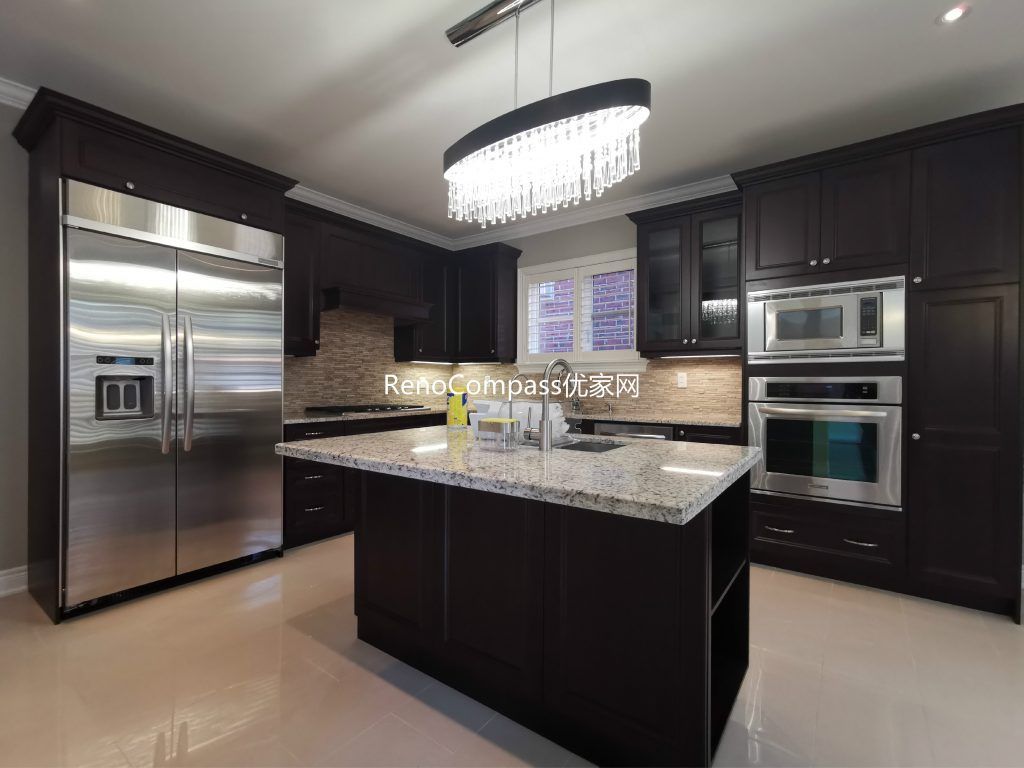 This Richmond Hill basement renovation includes a fully upgraded modern kitchen featuring custom dark wood cabinetry, quartz countertops, stainless steel appliances, and a spacious center island for added functionality. Designed and completed by a professional Toronto renovation company, the basement kitchen enhances both living convenience and rental potential. Elegant finishes, efficient layout planning, and high-quality materials create a stylish and practical secondary kitchen space for modern family living.