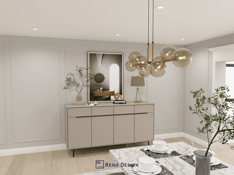 This image showcases a refined dining area within a Toronto bungalow interior design project, featuring custom sideboard cabinetry, soft neutral wall paneling, and a sculptural statement pendant light. Balanced proportions, warm finishes, and subtle decorative styling create a calm and elegant dining environment. Designed and completed by Reno Compass, this space reflects a modern interior approach tailored for single-level homes in Toronto.
