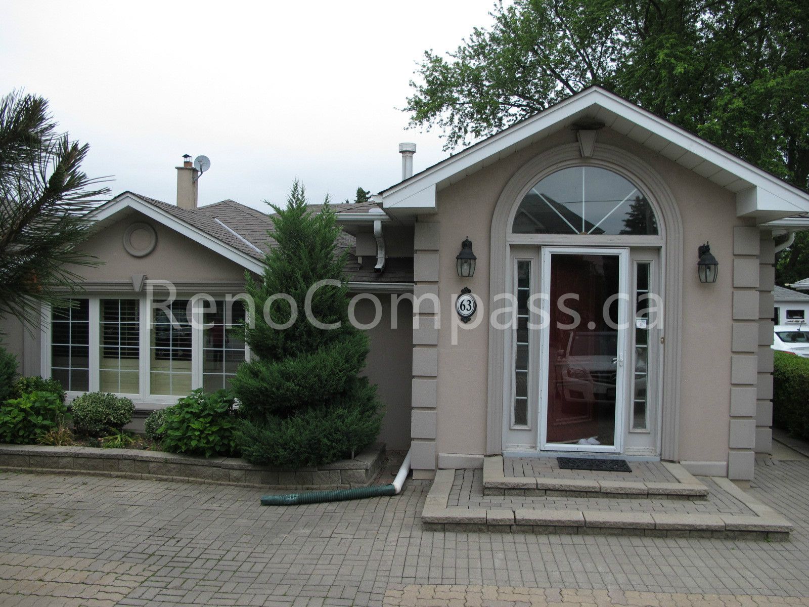 This image shows the exterior of a detached house undergoing a roofing renovation project in Vaughan, Greater Toronto Area. The roofing upgrade is designed to improve durability, weather resistance, and overall curb appeal. Completed by a professional Toronto Renovation Company, this roof renovation enhances both the protection and long-term value of the home.
