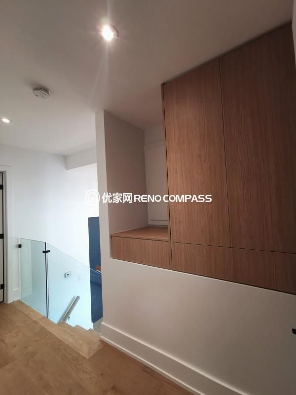 Custom floor-to-ceiling built-in storage cabinets completed as part of a North York interior renovation project. Warm wood-grain finishes, concealed hinges, and full-height doors create a clean, modern look while maximizing storage capacity.
