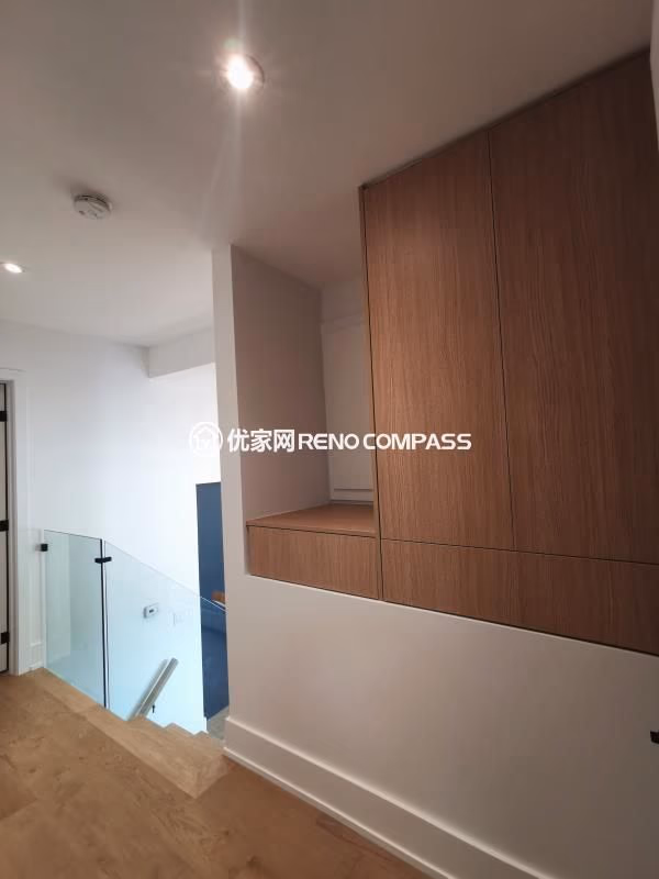 Custom floor-to-ceiling built-in storage cabinets completed as part of a North York interior renovation project. Warm wood-grain finishes, concealed hinges, and full-height doors create a clean, modern look while maximizing storage capacity.