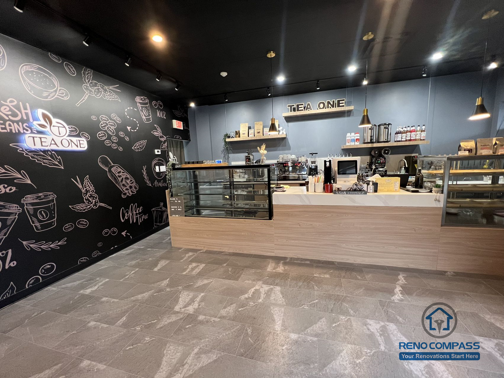 A completed Mississauga commercial renovation showcasing a restaurant front counter with custom finishes, durable flooring, and a streamlined service layout. Designed to support high-traffic operation while maintaining a clean and modern customer-facing space.