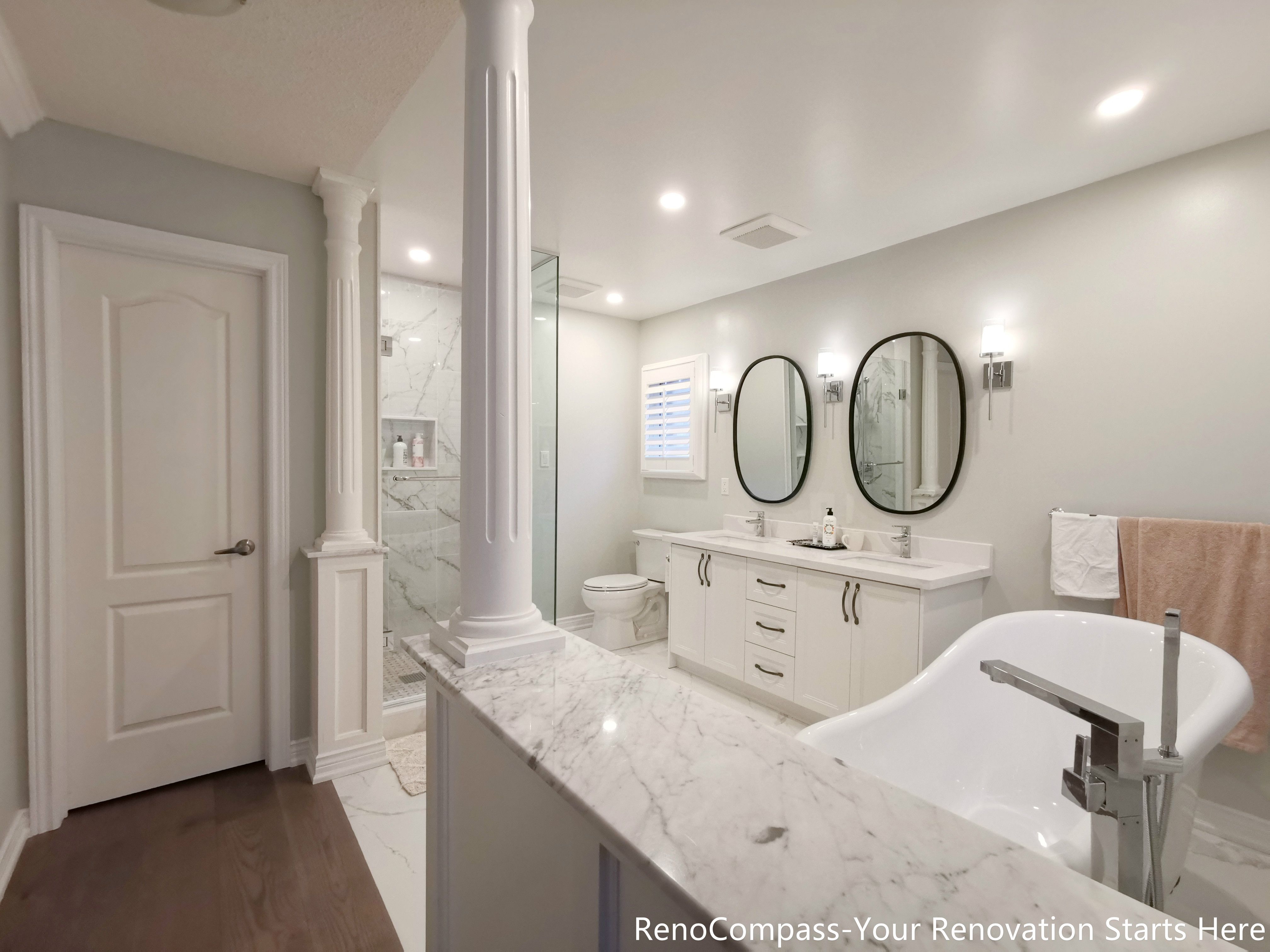 This Oakville interior renovation focused on elevating both comfort and material quality, with particular attention given to the bathroom and core living spaces. The project combines refined finishes with a practical layout, creating a home environment that feels both luxurious and suitable for long-term everyday use.

The bathroom renovation features elegant marble flooring, which adds visual depth while enhancing durability and ease of maintenance. A custom double vanity provides ample storage and shared functionality, making the space ideal for daily routines without congestion. An independent freestanding bathtub serves as a focal point of the room, offering a spa-inspired experience while maintaining a clean, balanced layout.

Throughout the interior, neutral tones and carefully selected materials create a cohesive visual flow. Clean lines, precise detailing, and thoughtful spacing ensure the design feels open rather than overdecorated. Lighting and fixtures were chosen to complement the stone finishes, enhancing both warmth and clarity across the space.

This Oakville interior renovation reflects a design approach that prioritizes quality materials, functional planning, and timeless aesthetics. Executed by Reno Compass, the project delivers a refined interior that balances everyday practicality with a sense of understated luxury.