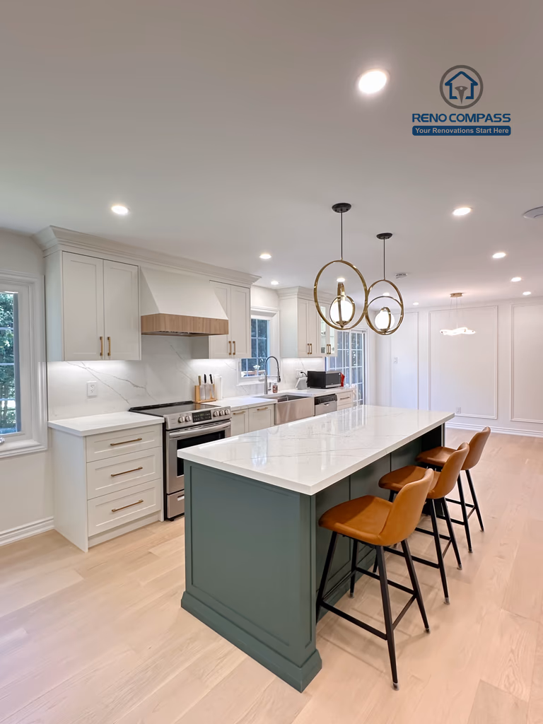 This Markham kitchen renovation highlights a spacious central island with seating, paired with a well-organized cooking area featuring quartz countertops, custom cabinetry, and stainless steel appliances. Pendant lighting and recessed ceiling lights provide balanced illumination, while wide-plank hardwood flooring enhances continuity throughout the space. Completed by a professional Toronto renovation company, Reno Compass Inc., the kitchen is designed for efficiency, comfort, and everyday use.