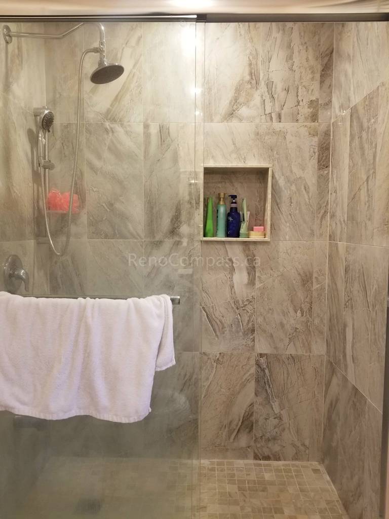 This Markham bathroom renovation features newly installed shower wall tiles with a built-in recessed niche for convenient storage. The modern tile design enhances both functionality and visual appeal, providing a clean, elegant finish that is easy to maintain. As part of a full bathroom upgrade including new flooring, shower, and vanity, the space now offers improved comfort, durability, and a contemporary look for everyday use.
