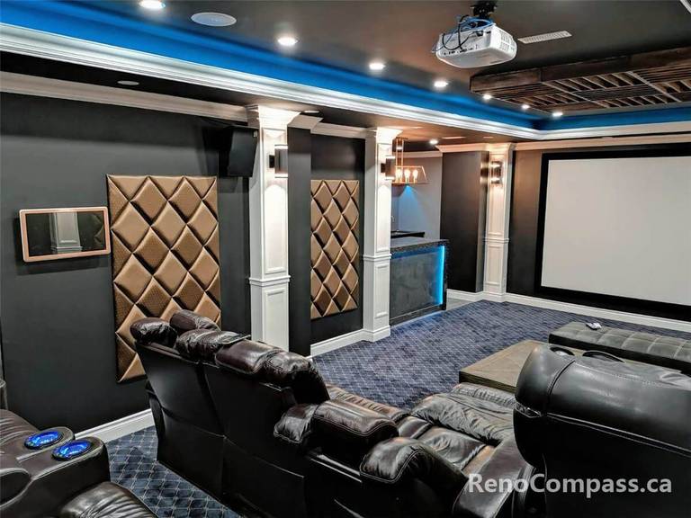 This image presents a luxury home theater room featuring a large projection screen, tiered leather seating, recessed ceiling lighting, and a professionally designed layout for an immersive cinematic experience.