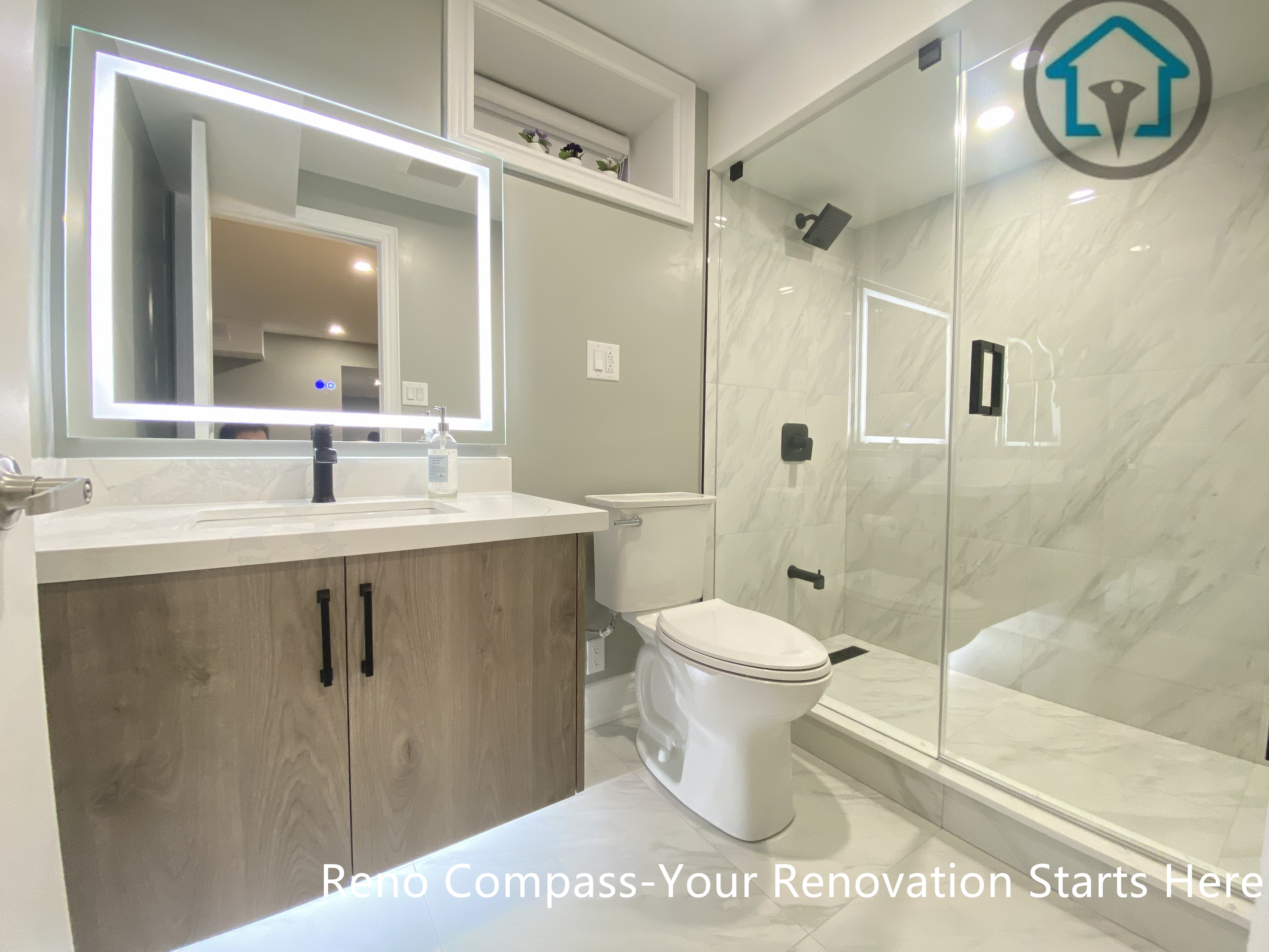 Custom basement wet bar completed in Vaughan, featuring built-in cabinetry, quartz countertop, undermount sink, and integrated dishwasher. Designed to support entertaining and everyday use as part of a full basement renovation by Reno Compass.