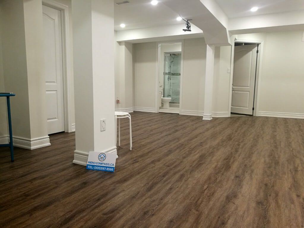 This finished basement renovation in Markham showcases a spacious open-concept layout designed for flexibility and everyday comfort. The renovation features high-quality vinyl flooring, modern recessed lighting, structural column refinishing, and a bright neutral color palette that enhances the sense of space. A newly upgraded basement bathroom and multiple storage areas improve functionality, creating a versatile lower level suitable for family living, recreation, or guest use. Completed by a trusted Toronto renovation company, this project highlights practical design and clean craftsmanship for modern homes.