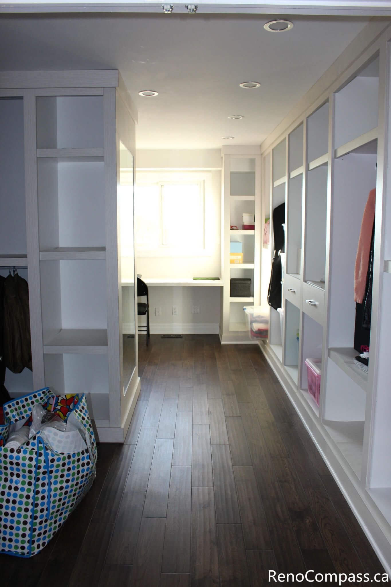 This custom walk-in closet and storage area is part of a full house renovation project in Mississauga completed by a professional Toronto renovation company. Featuring built-in shelving, wardrobe storage, and modern lighting, the space is designed to improve organization and maximize functionality. The renovation enhances daily convenience while creating a clean, bright, and well-structured interior that adds both comfort and value to the home.