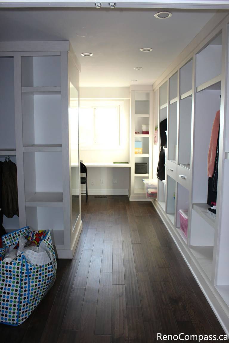 This custom walk-in closet and storage area is part of a full house renovation project in Mississauga completed by a professional Toronto renovation company. Featuring built-in shelving, wardrobe storage, and modern lighting, the space is designed to improve organization and maximize functionality. The renovation enhances daily convenience while creating a clean, bright, and well-structured interior that adds both comfort and value to the home.