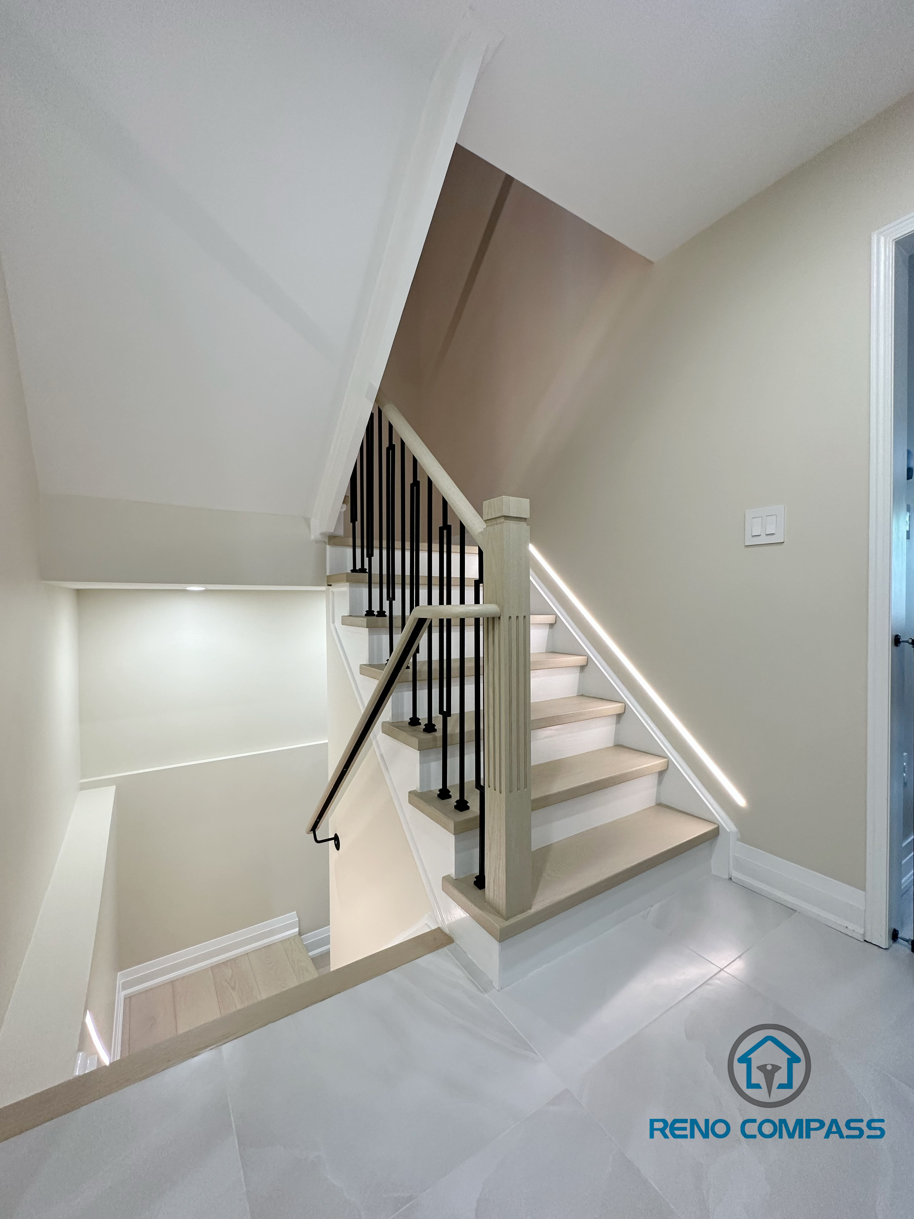 This image showcases our completed light wood staircase renovation in Vaughan. Featuring natural pale wood treads and minimalist metal railings, this design creates a warm, bright, and airy modern feel for the home. We specialize in custom interior renovations across the Greater Toronto and Vaughan area.