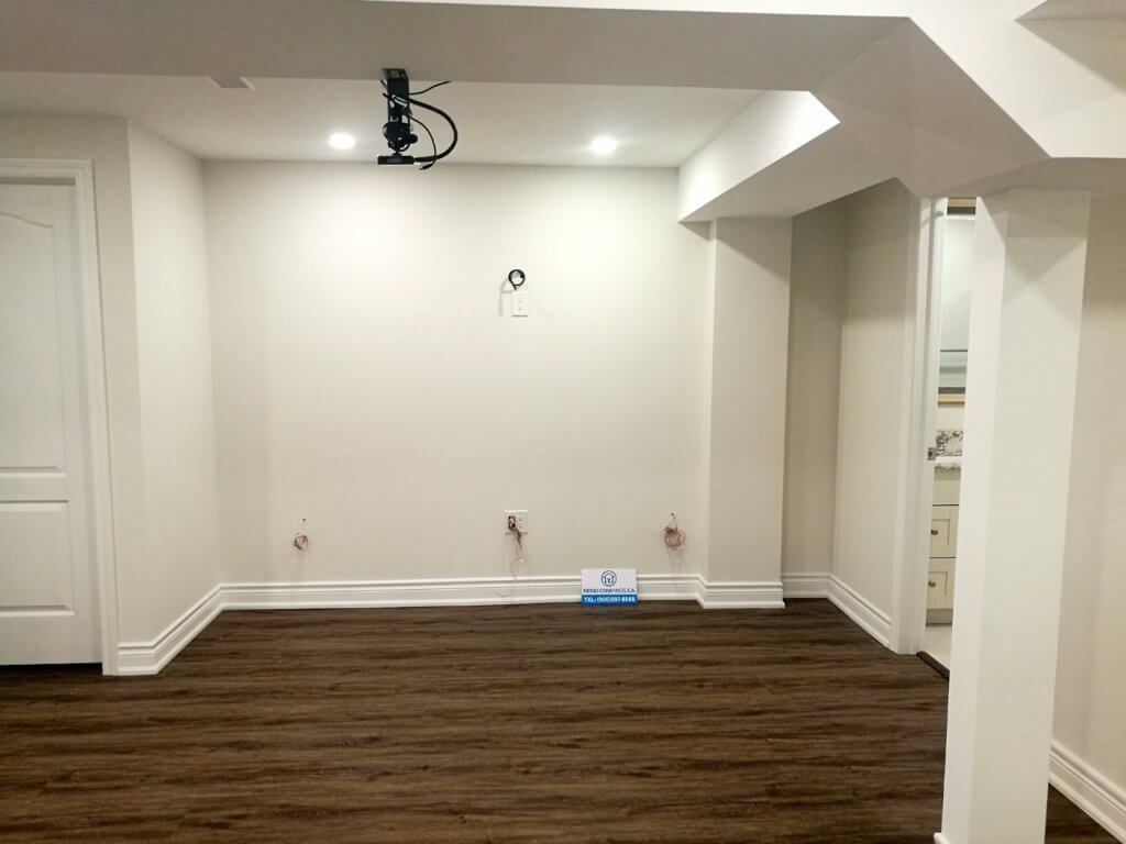 This finished basement renovation in Markham showcases a spacious open-concept layout designed for flexibility and everyday comfort. The renovation features high-quality vinyl flooring, modern recessed lighting, structural column refinishing, and a bright neutral color palette that enhances the sense of space. A newly upgraded basement bathroom and multiple storage areas improve functionality, creating a versatile lower level suitable for family living, recreation, or guest use. Completed by a trusted Toronto renovation company, this project highlights practical design and clean craftsmanship for modern homes.