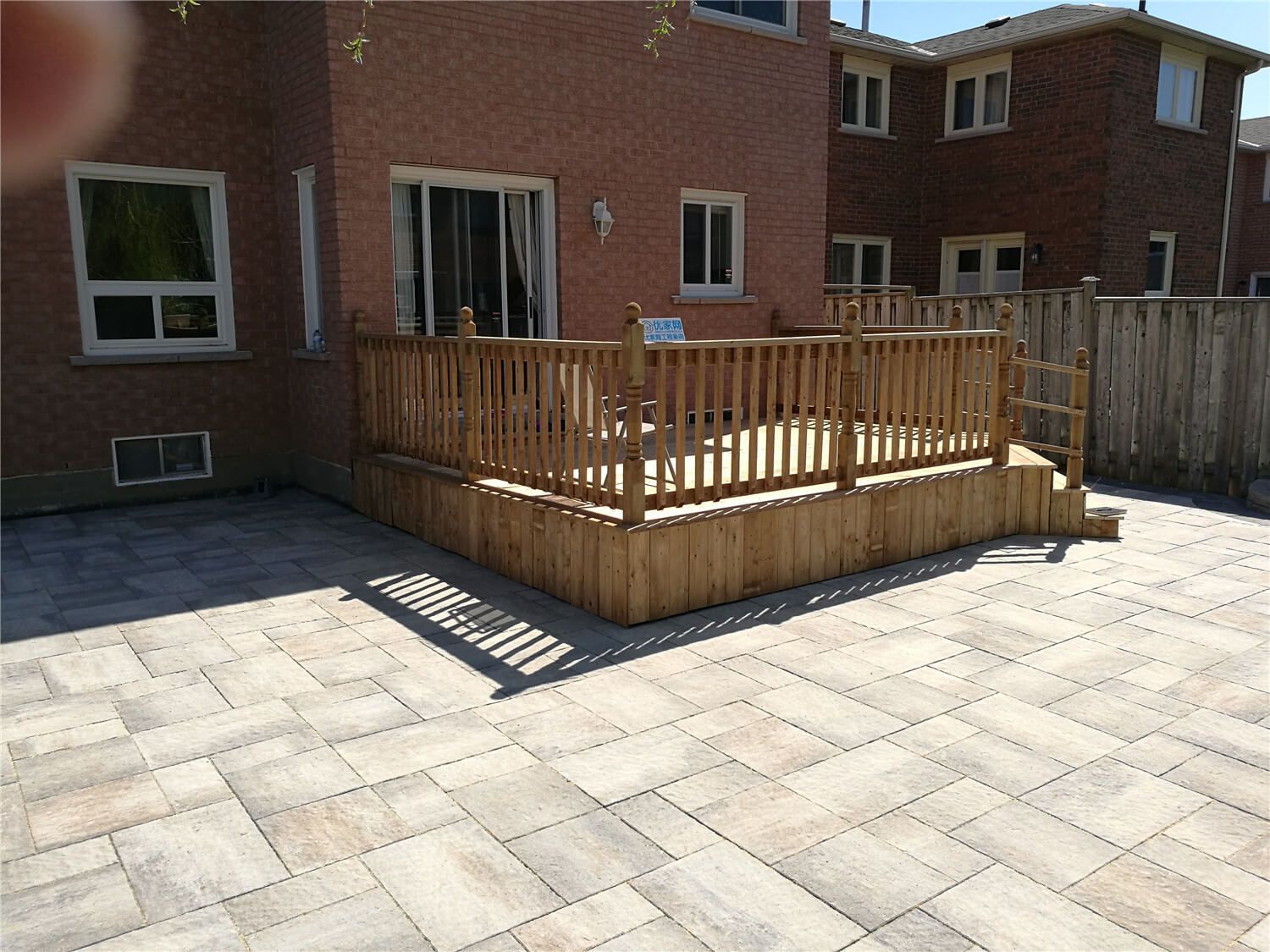 This Richmond Hill landscaping renovation showcases a newly completed backyard patio with large-format interlocking stone installation. Designed for durability and modern outdoor living, the spacious patio features clean lines, contrasting border stones, and precise leveling for proper drainage. The upgraded hardscape creates a functional entertainment area perfect for family gatherings while enhancing the overall backyard layout and property value. Professional installation ensures long-lasting performance, weather resistance, and a refined outdoor finish suitable for all-season use in the GTA.