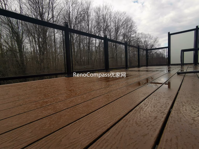 Professional deck construction project in Aurora featuring durable composite wood decking, modern black aluminum and glass railings, and a spacious outdoor layout. Designed for long-term durability and low maintenance, this backyard deck enhances outdoor comfort, safety, and property value.