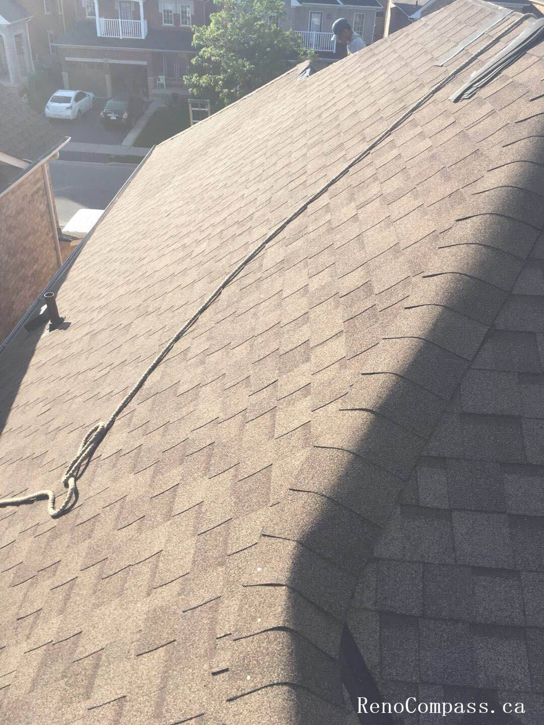 This image showcases the completed stage of a residential roofing replacement project in Toronto, featuring newly installed asphalt shingles with clean alignment and consistent finishing. The roofing system has been carefully installed to ensure proper ventilation, waterproof protection, and long-term durability against Toronto’s seasonal weather conditions. Attention to detail in shingle layout, ridge finishing, and overall roof slope enhances both structural performance and exterior curb appeal. Completed by a professional Toronto roofing and renovation team, this new roof installation provides improved energy efficiency, reliable protection, and a refreshed exterior look for the home.