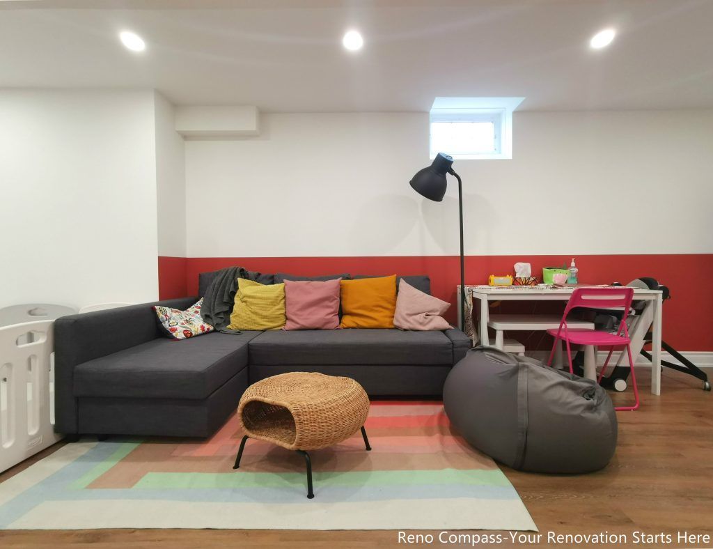 This image features a renovated basement family room in Vaughan, designed as a flexible living space suitable for relaxation, play, and everyday family activities. The layout combines comfortable seating, soft lighting, and durable wood flooring to create a welcoming and practical environment. Recessed ceiling lights and a small window provide balanced illumination, while the open arrangement allows the space to adapt to different uses such as lounging, children’s activities, or casual gatherings. This basement renovation demonstrates the thoughtful space planning and construction quality delivered by a professional Toronto renovation company focused on functional residential interiors.