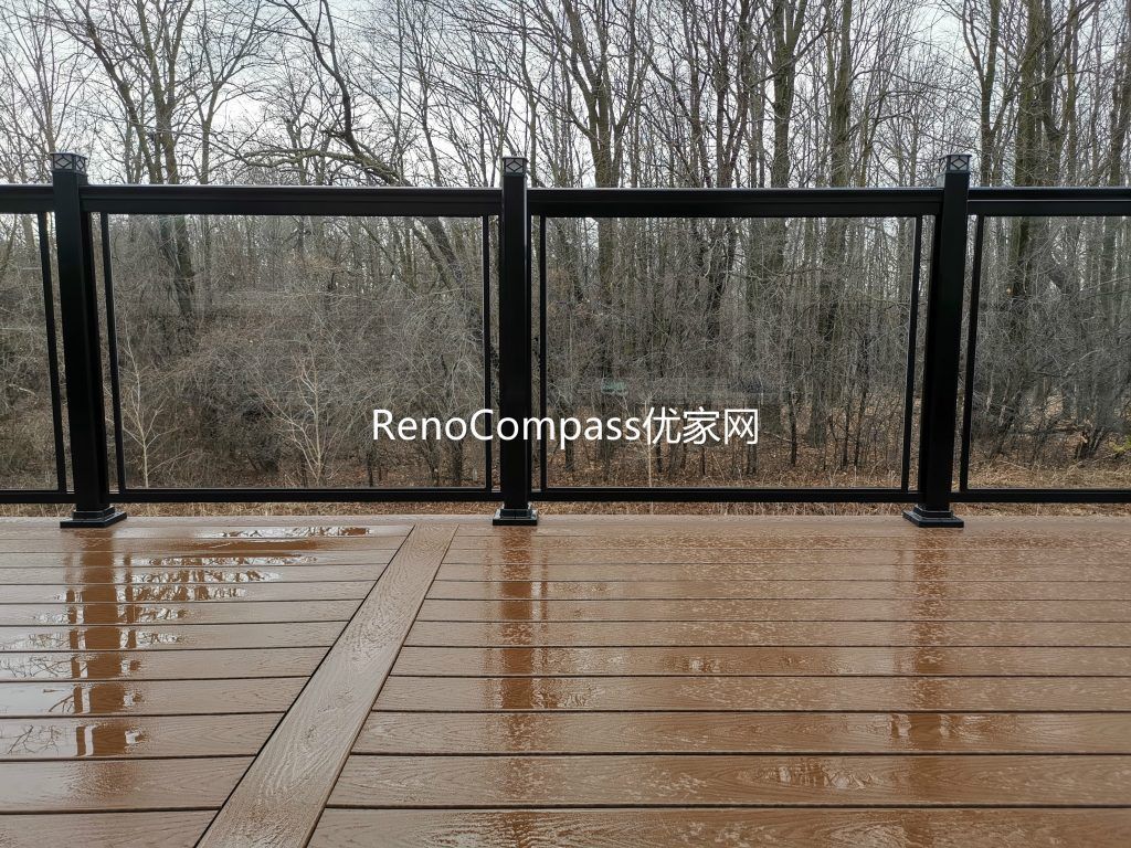 Aurora backyard deck renovation featuring premium composite decking, sleek black aluminum and glass railings, and professional outdoor construction. Designed for durability and low maintenance, this modern deck provides a safe, stylish, and functional outdoor living space while enhancing overall property value.