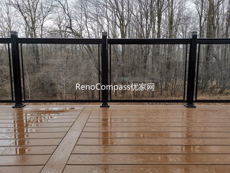 Aurora backyard deck renovation featuring premium composite decking, sleek black aluminum and glass railings, and professional outdoor construction. Designed for durability and low maintenance, this modern deck provides a safe, stylish, and functional outdoor living space while enhancing overall property value.