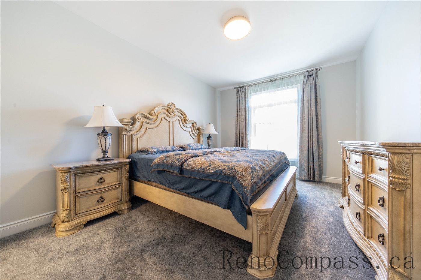 This Richmond Hill bedroom renovation features classic wall panel detailing, upgraded lighting, soft carpeting, and a refined layout that enhances comfort and elegance. The cohesive design and quality finishes create a warm, luxurious atmosphere, showcasing the craftsmanship of a trusted Toronto renovation company specializing in full house interior renovations.