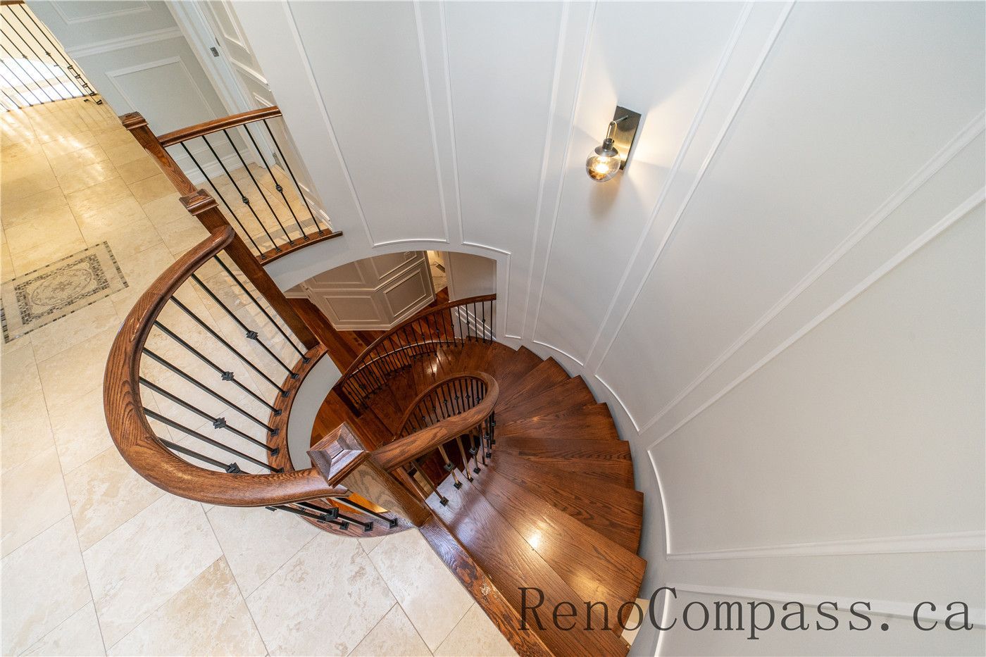 This Richmond Hill staircase renovation features custom wood steps, modern iron railings, and elegant wall panel detailing that enhance the home’s architectural flow. The upgraded finishes and open design create a bright and sophisticated transition between floors, showcasing the craftsmanship of a trusted Toronto renovation company specializing in full house interior renovations.