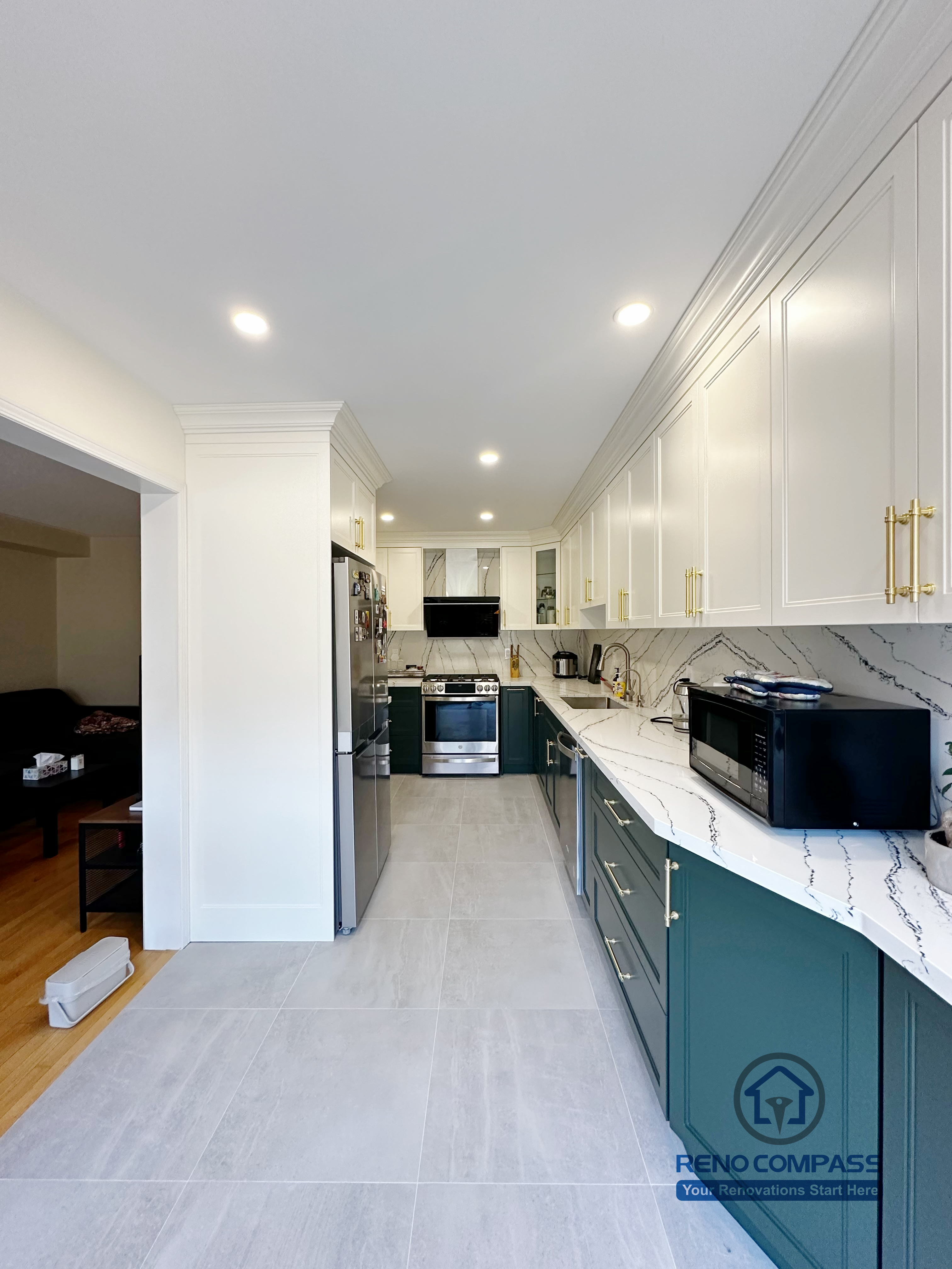 A completed Mississauga kitchen renovation featuring integrated stainless steel appliances, custom-built cabinets, and durable quartz countertops. This layout focuses on efficiency, storage optimization, and long-term functionality for everyday kitchen use.