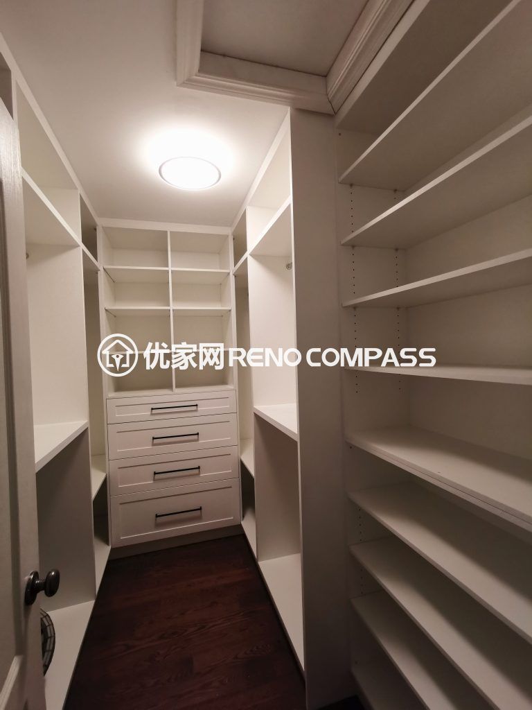 Custom walk-in closet renovation in Richmond Hill featuring built-in shelving, drawer storage, and organized wardrobe space. Designed for maximum storage efficiency and clean modern aesthetics, this interior renovation enhances daily functionality and home value by a professional Toronto renovation company.