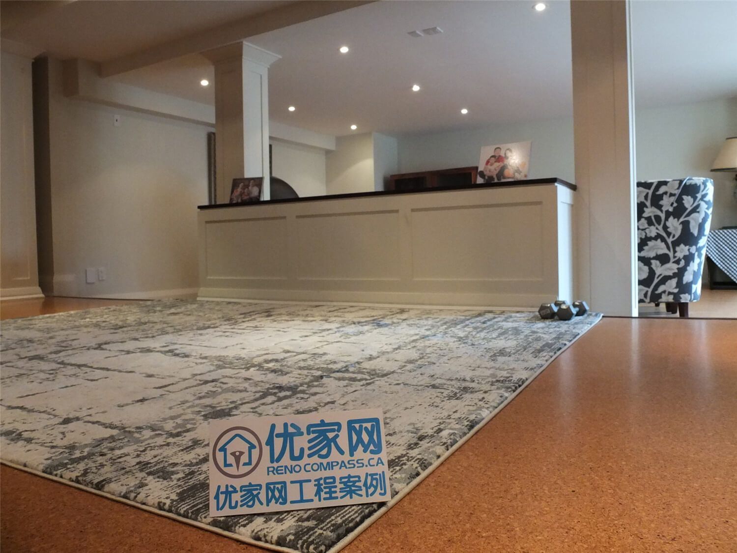 This Oakville basement renovation showcases an open-concept living space featuring engineered flooring, custom half-wall paneling, and recessed pot lighting. The layout creates a spacious and inviting environment suitable for family gatherings and relaxation. Completed by a professional Toronto Renovation Company, the project highlights clean craftsmanship, balanced lighting, and a modern basement design tailored for comfortable everyday living.