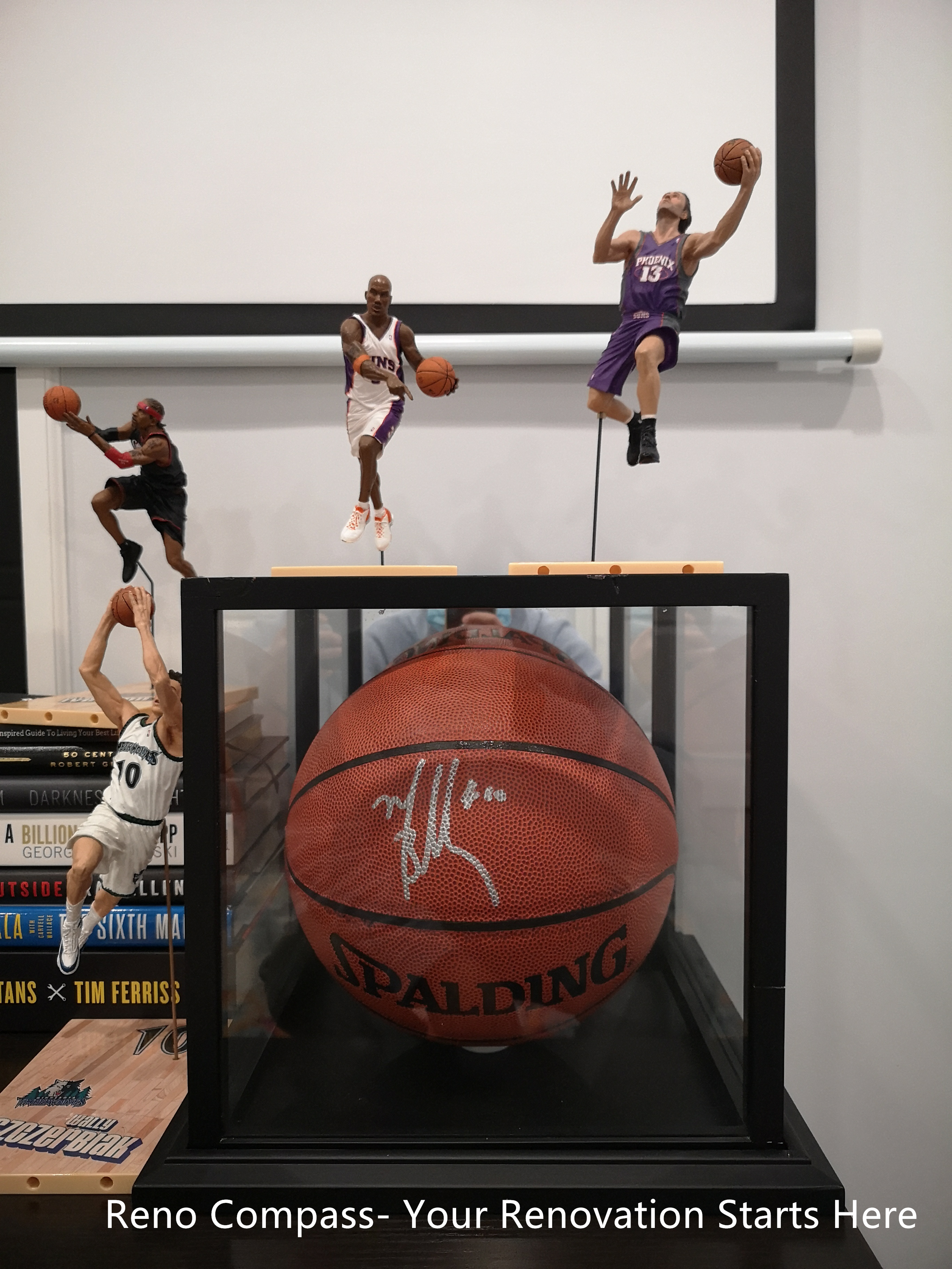 This Whitby basement renovation highlights a recreation-focused space featuring custom display shelving for sports memorabilia and personal collections. The built-in shelving adds character and individuality to the finished basement while maintaining a clean and organized appearance. Integrated within the larger basement layout, this detail emphasizes how the space can be tailored for entertainment, hobbies, or personal interests. The design supports a lifestyle-oriented basement environment that balances functionality with personal expression.