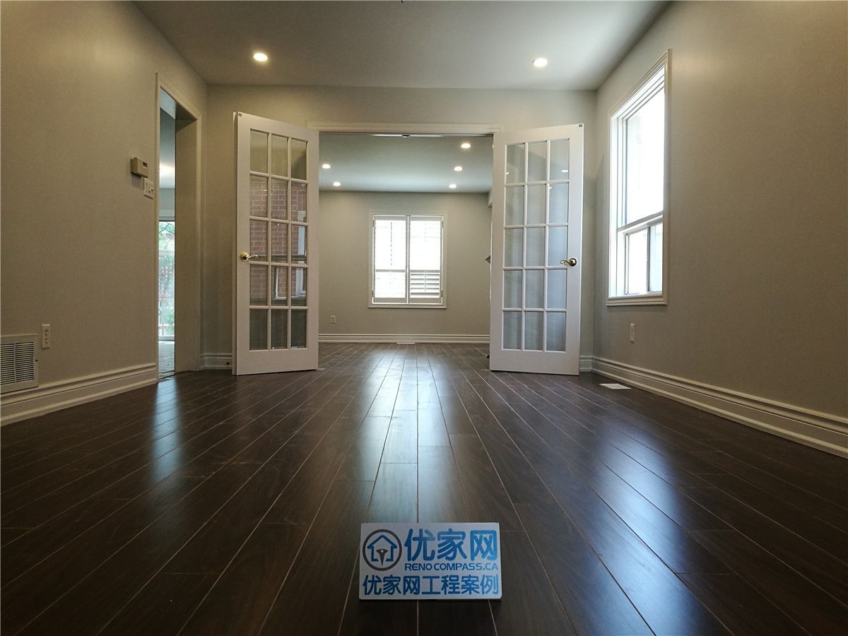 This Mississauga large-scale interior renovation features an elegant open-concept layout enhanced by rich dark hardwood flooring and classic French glass double doors. The symmetrical flow between rooms creates visual depth while maximizing natural light from multiple window exposures.

The project highlights detailed trim work, smooth wall finishes, recessed ceiling lighting, and seamless flooring transitions throughout the space. Designed for homeowners seeking a refined and spacious interior upgrade, this renovation reflects both craftsmanship and architectural balance in a full home remodeling project in the GTA.