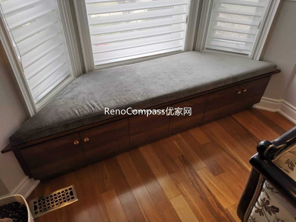 This Richmond Hill interior renovation features a custom-built window bench with integrated storage drawers and hardwood flooring. Designed to maximize functionality while enhancing comfort and natural light, the built-in seating showcases the detailed craftsmanship of a trusted Toronto renovation company specializing in full house interior renovations and custom millwork.