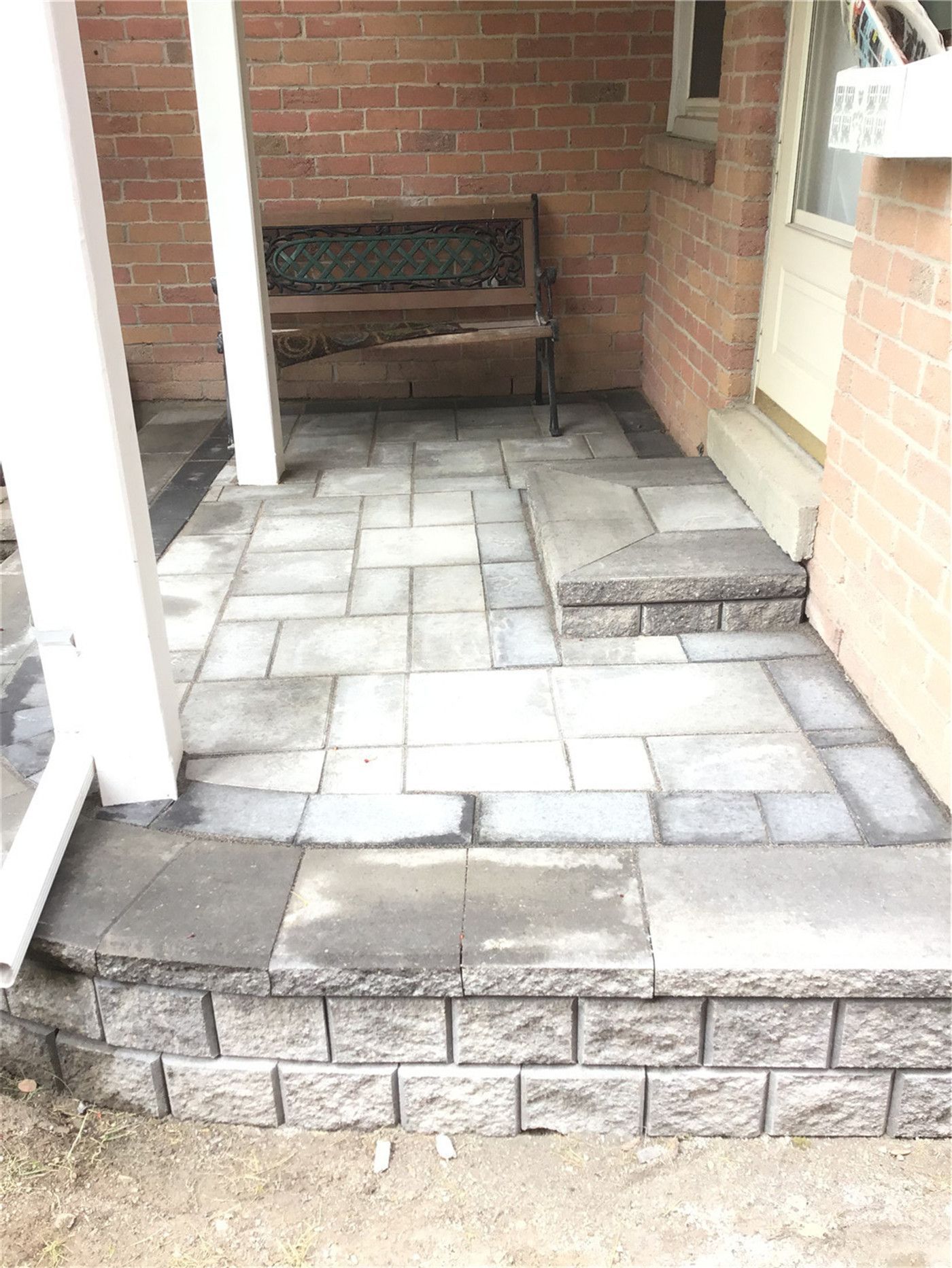 This Oakville interlocking project features a spacious backyard patio built with large-format grey pavers and clean border detailing. The design includes solid step construction leading to the entrance, creating a functional and visually balanced outdoor space. Ideal for relaxing or entertaining, this low-maintenance patio enhances both usability and property value.